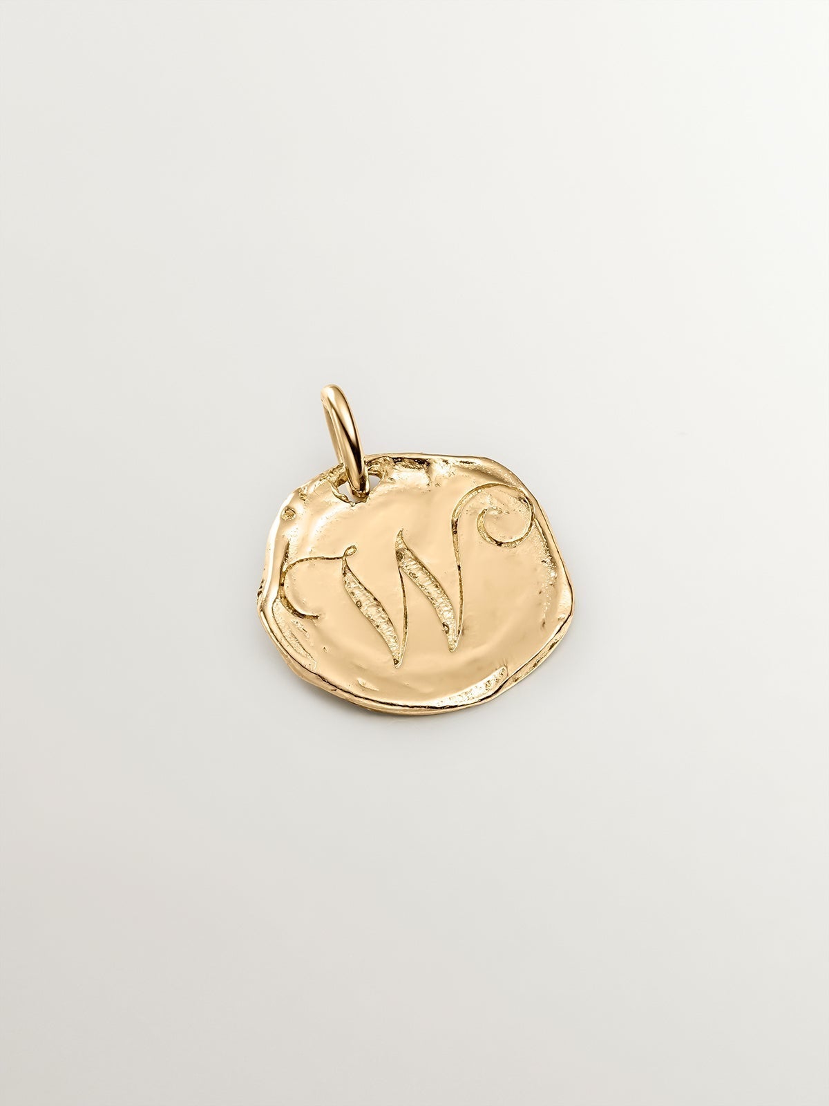 Handcrafted 925 silver charm bathed in 18K yellow gold with initial W.