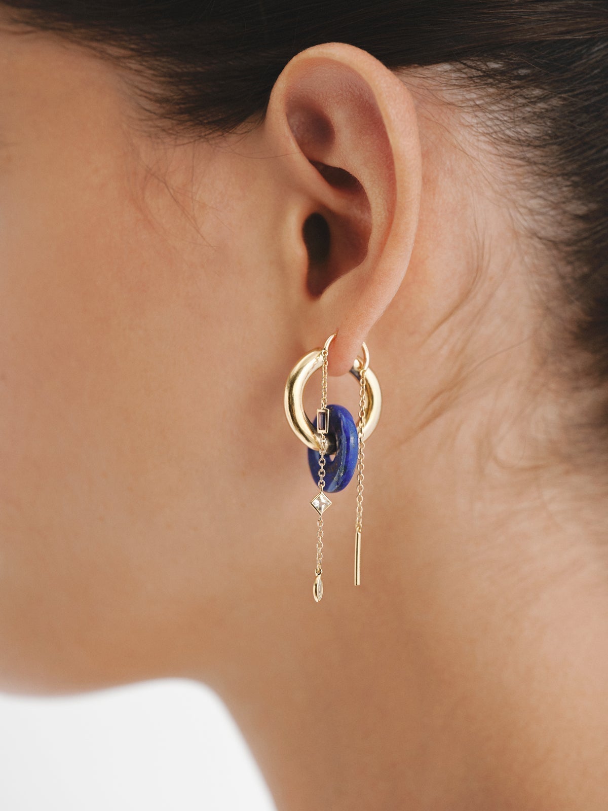 Individual earring made of 925 silver, bathed in 18K yellow gold with rhodolite, quartz and topaz.