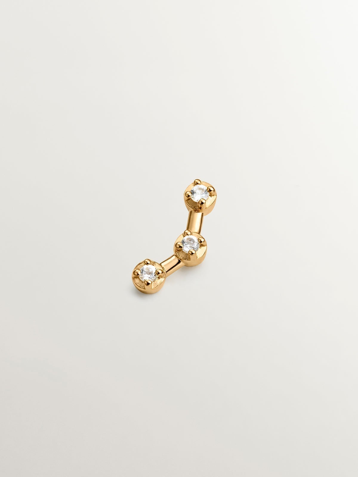 Single climbing earring made of 925 silver coated in 18K yellow gold with white topaz.