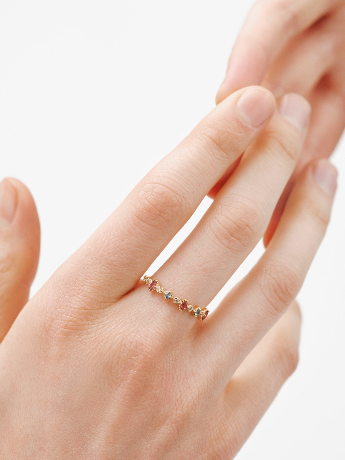 925 Silver ring bathed in 18K yellow gold with topaz and rhodolites.