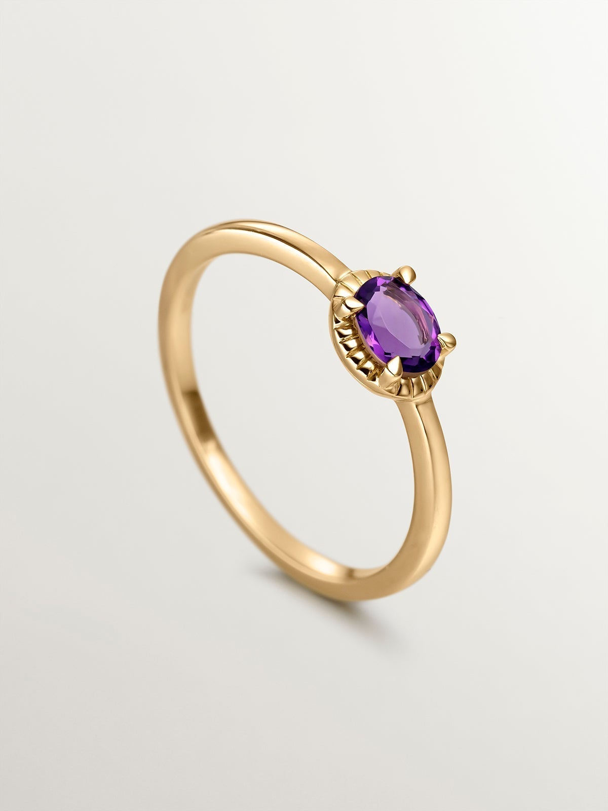 925 Silver ring bathed in 18K yellow gold with purple amethyst stone.