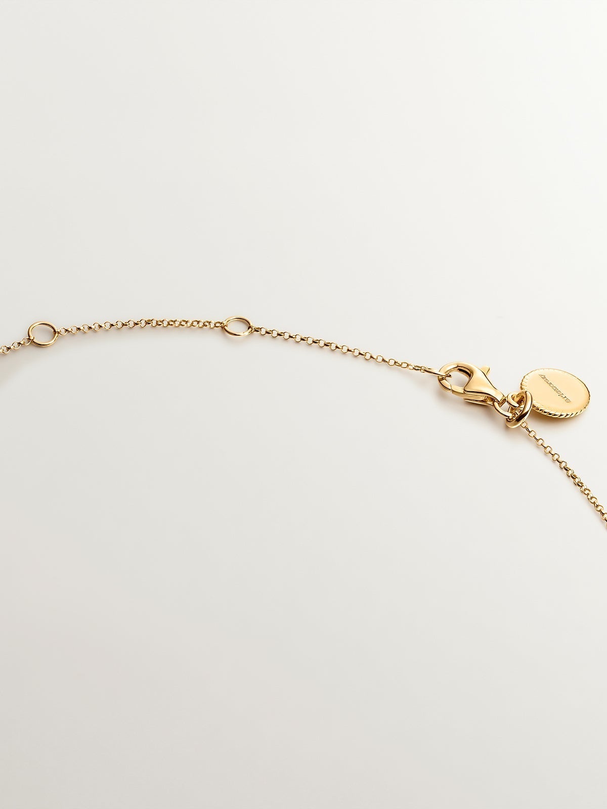 925 Silver pendant bathed in 18K yellow gold with sky blue topaz.