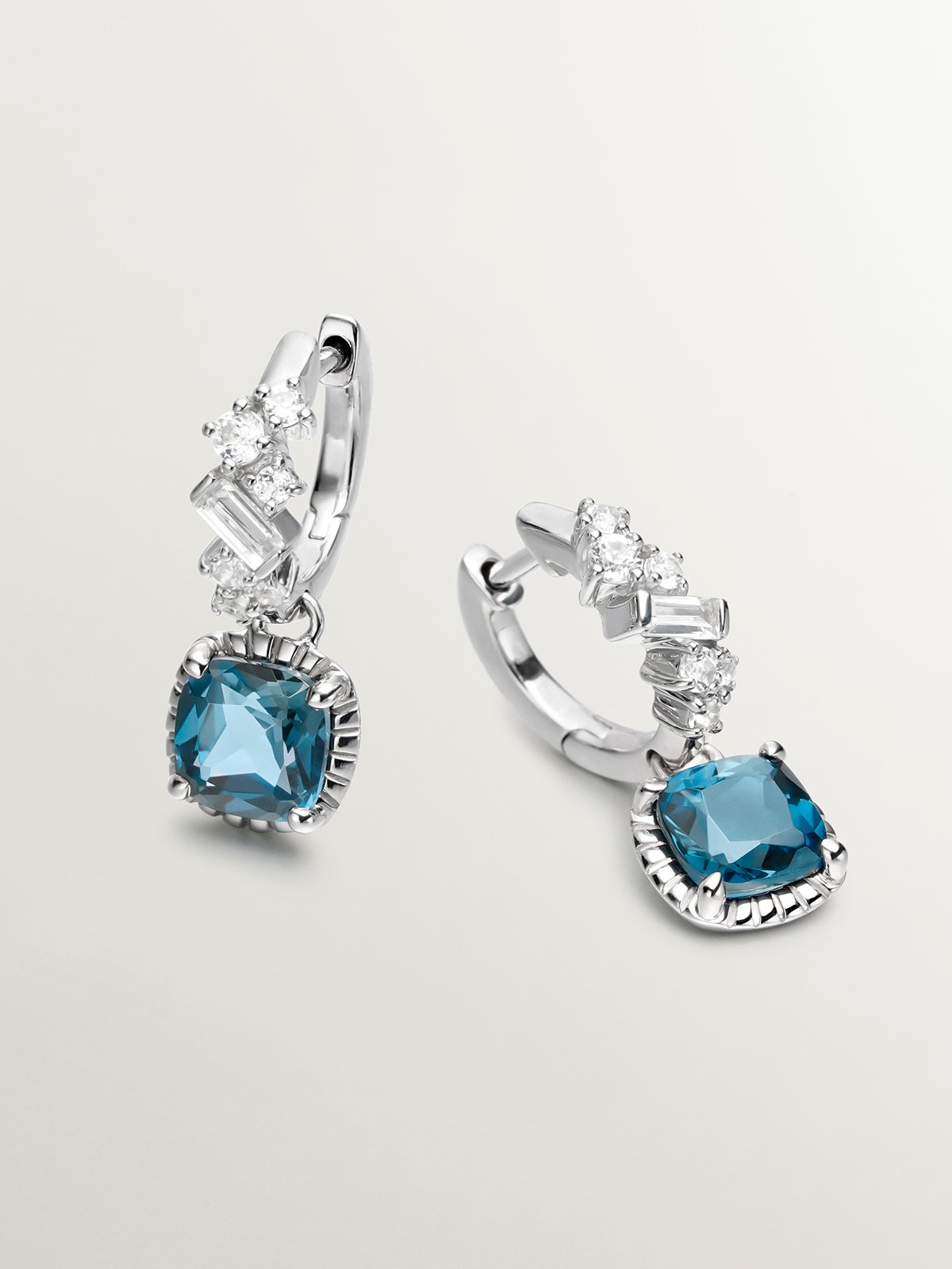 925 Silver hoop earrings with London blue and white topazes.