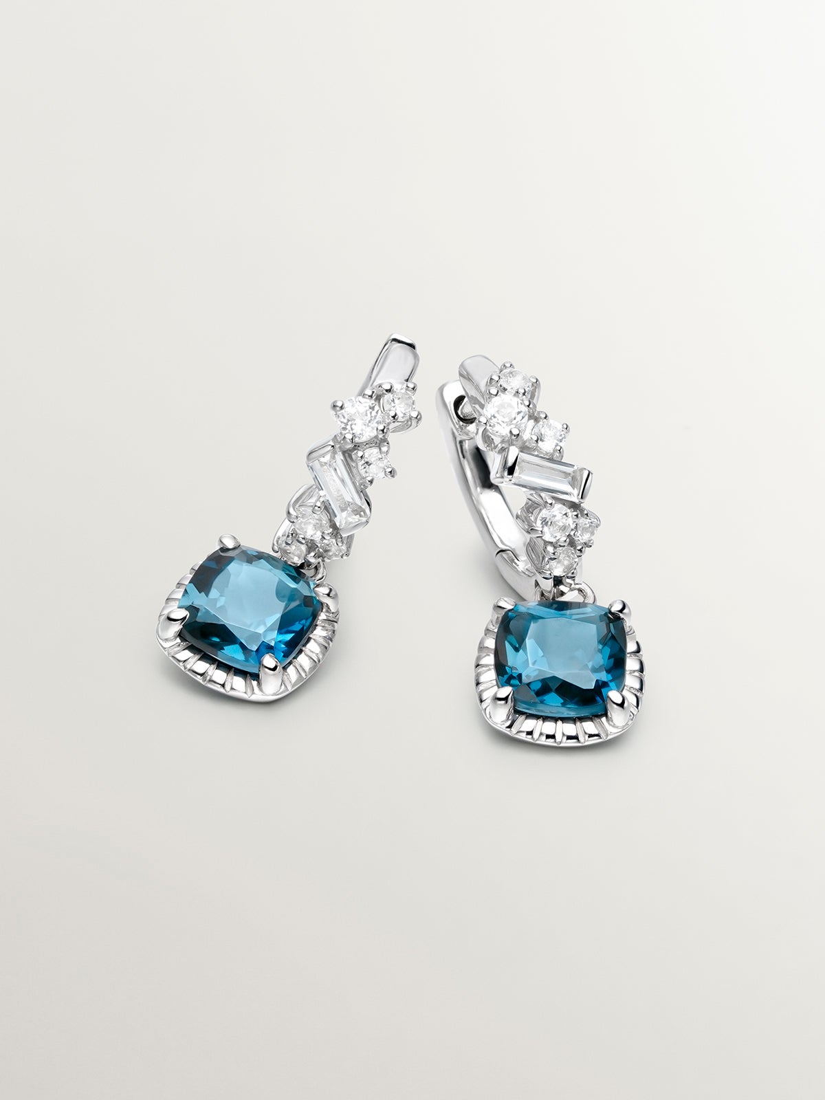 925 Silver hoop earrings with London blue and white topazes.