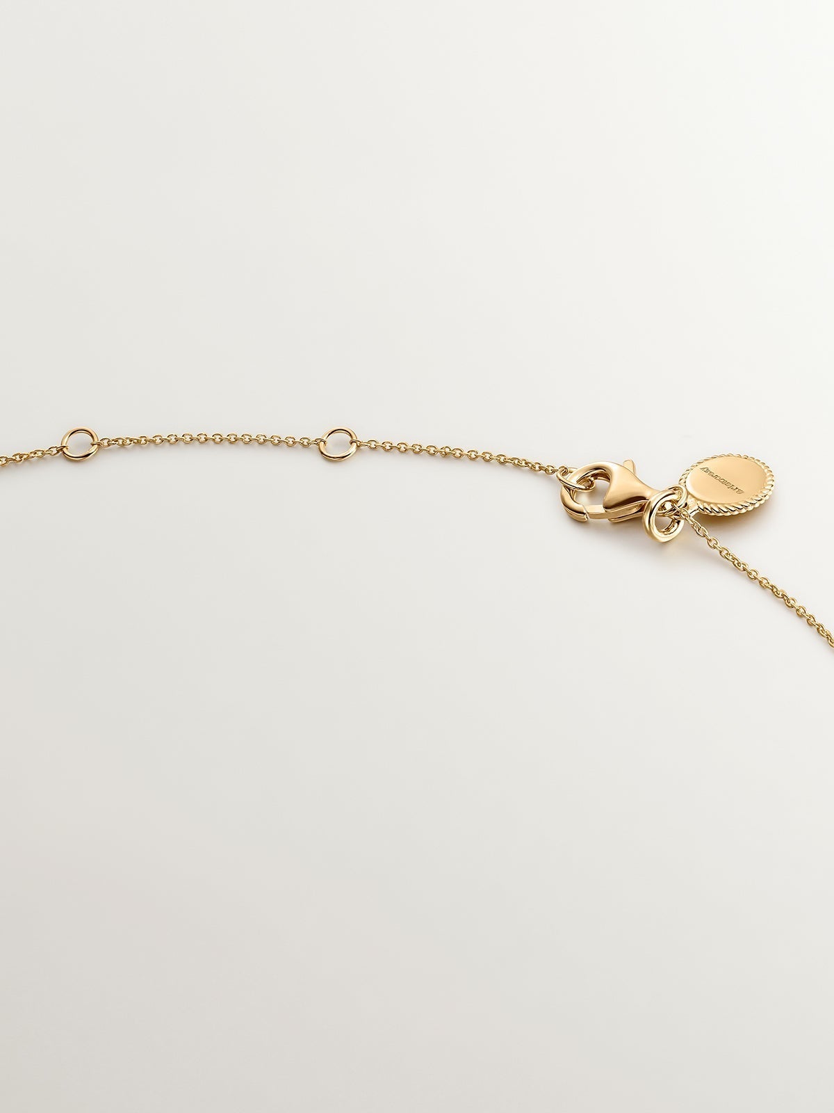 925 silver necklace bathed in 18K yellow gold with white topaz stones