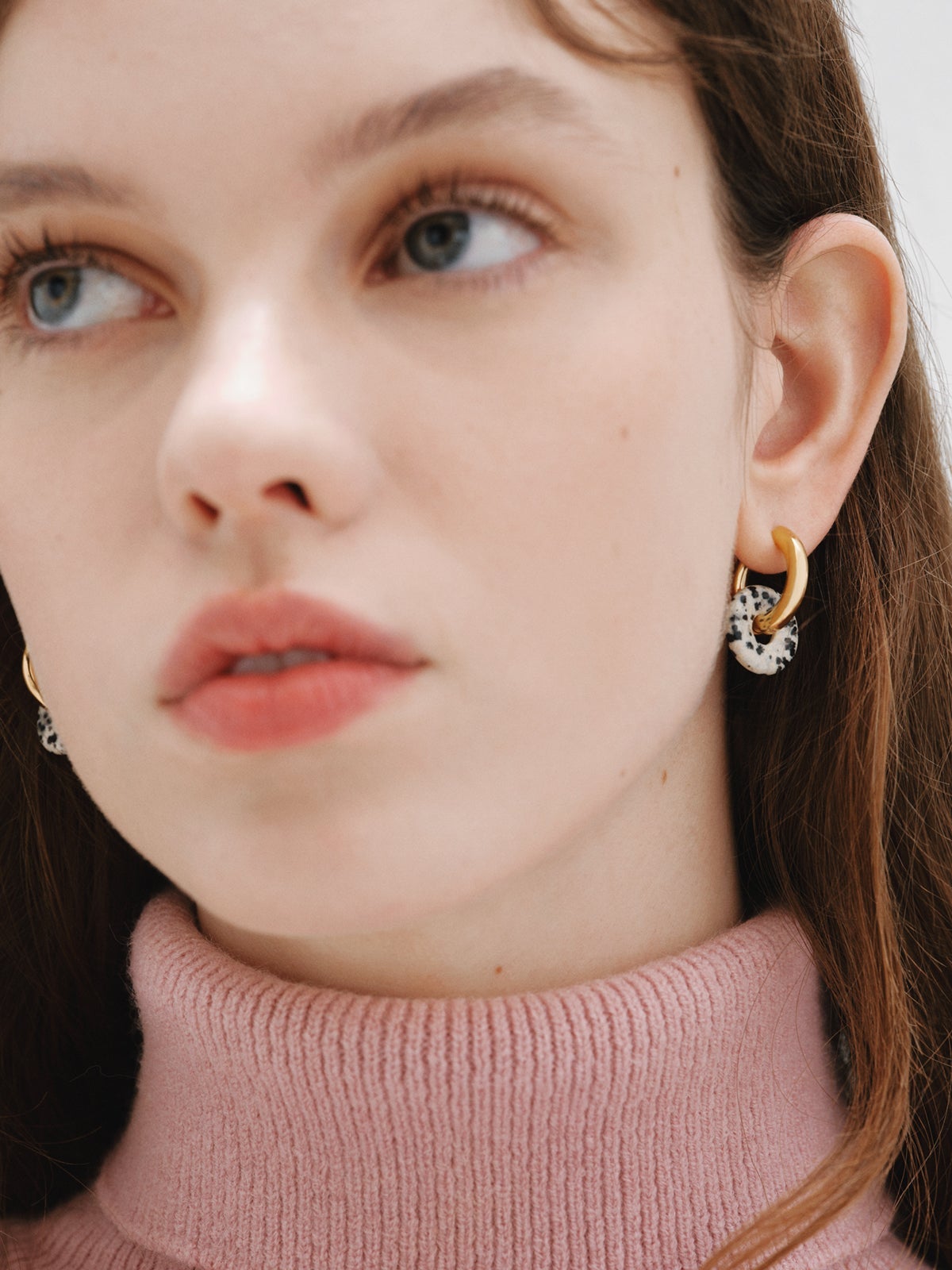 925 sterling silver medium hoop earrings with 18K yellow gold plating featuring dalmatian jasper.