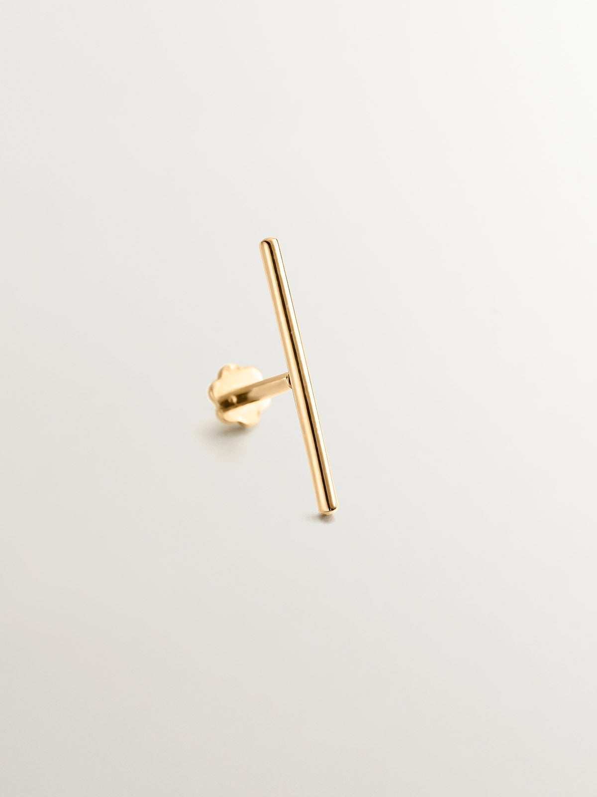 Piercing barra industrial de oro amarillo de 18K