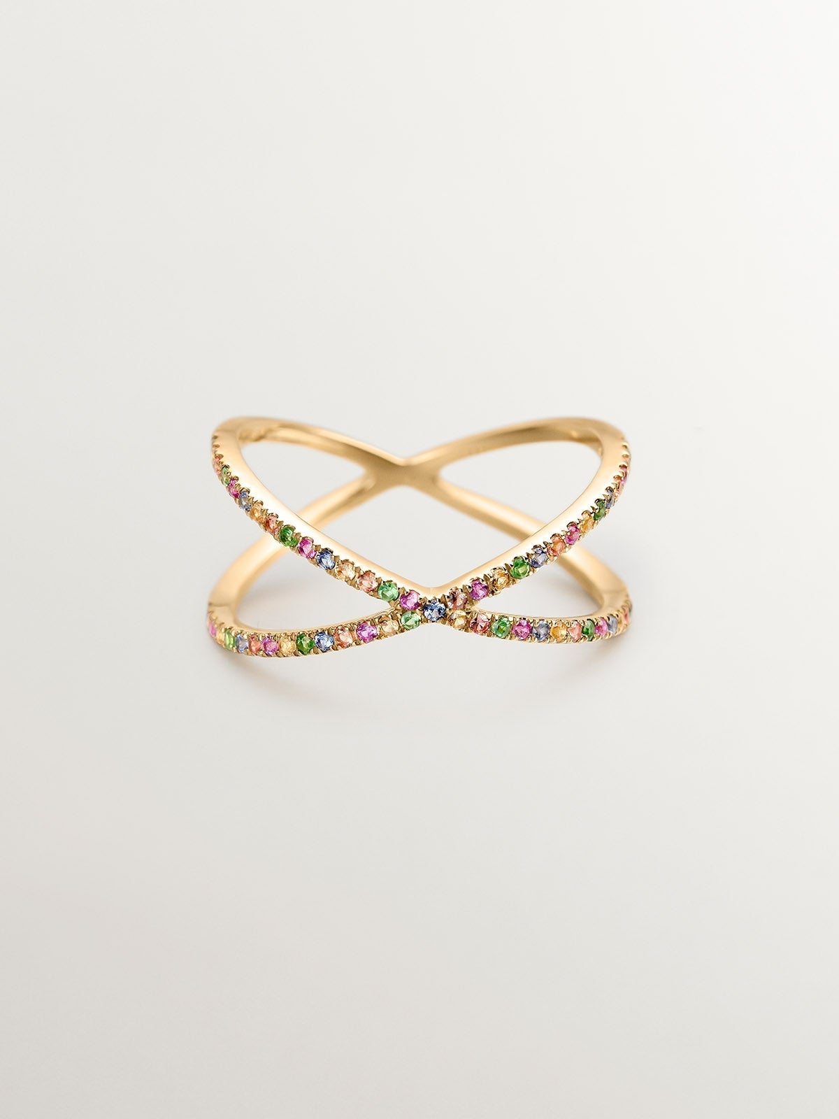 Double crossed 9K yellow gold ring with tsavorites and multicolor sapphires.