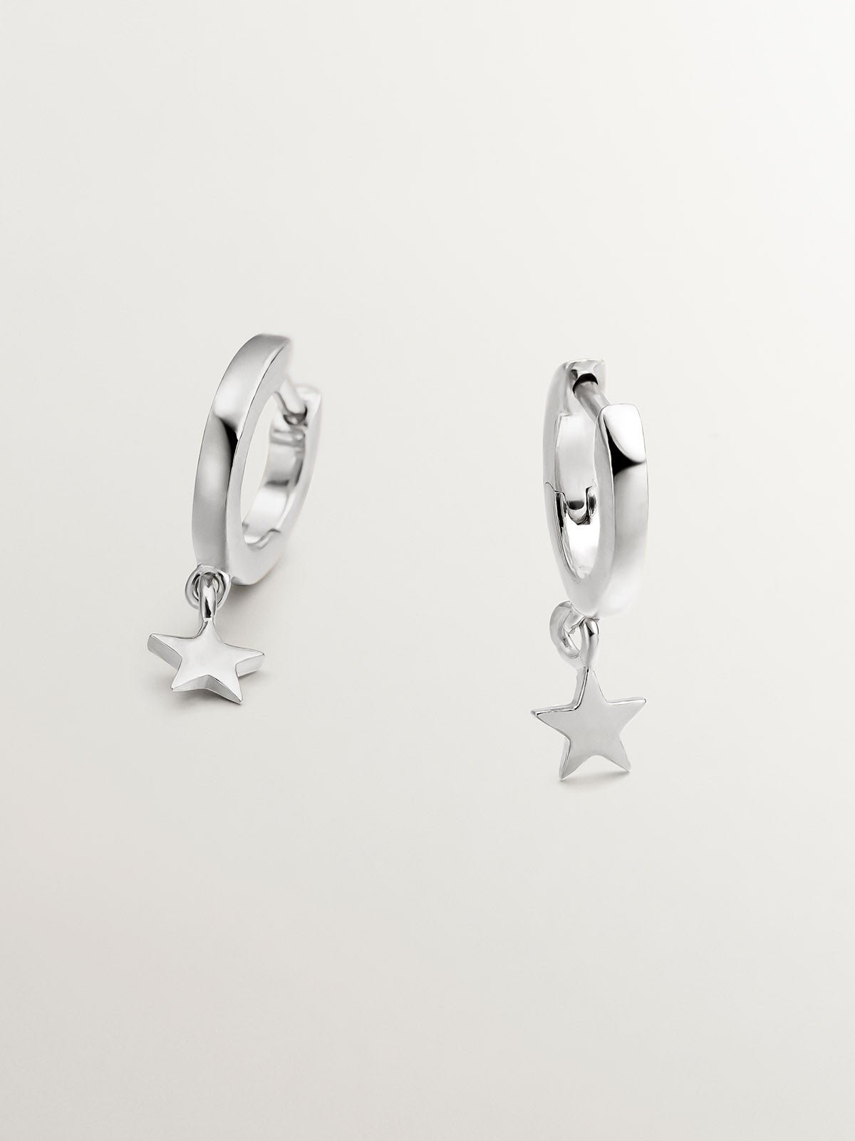 Small 925 silver hoop earrings with star.