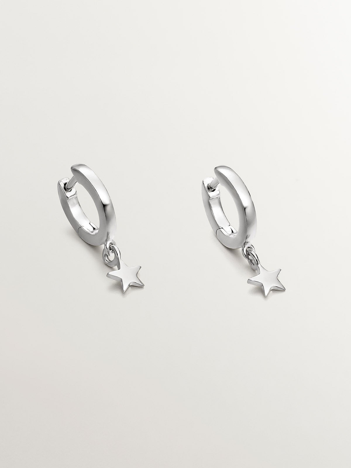 Small 925 silver hoop earrings with star.
