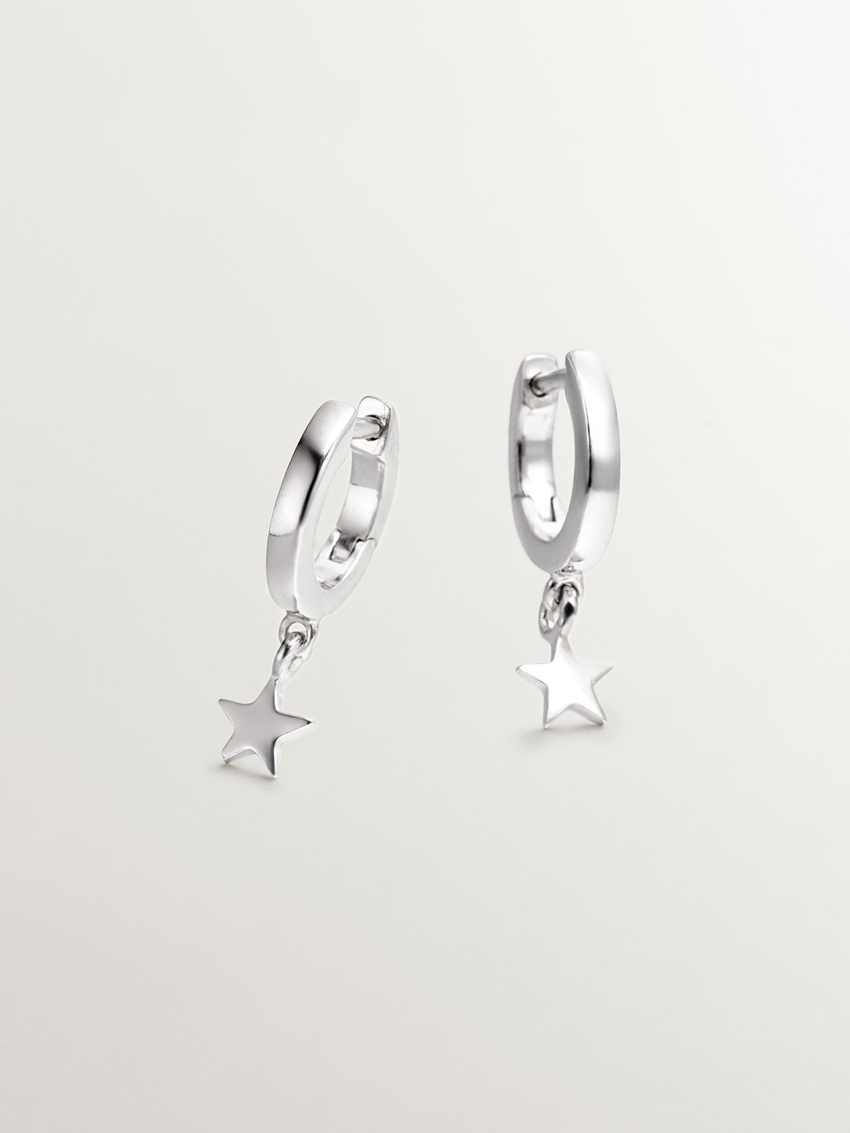 Small 925 silver hoop earrings with star.
