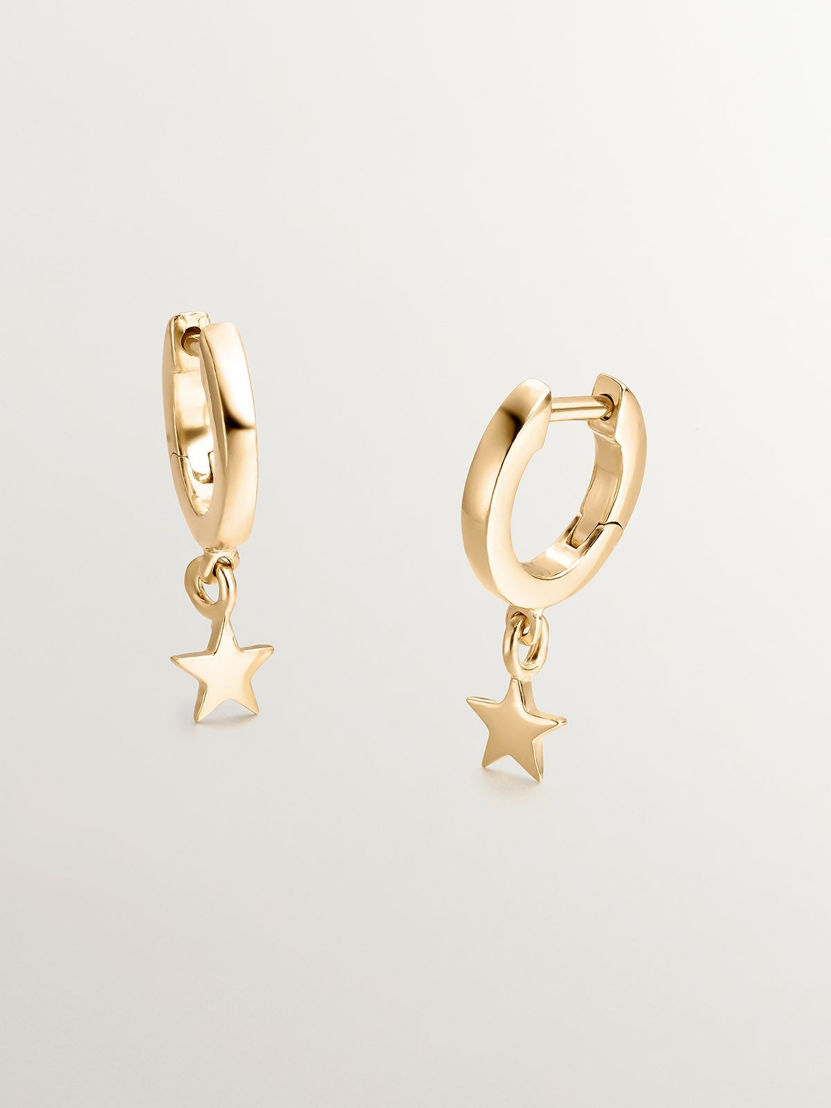 Small hoop earrings made of 925 silver, bathed in 18K yellow gold with star.