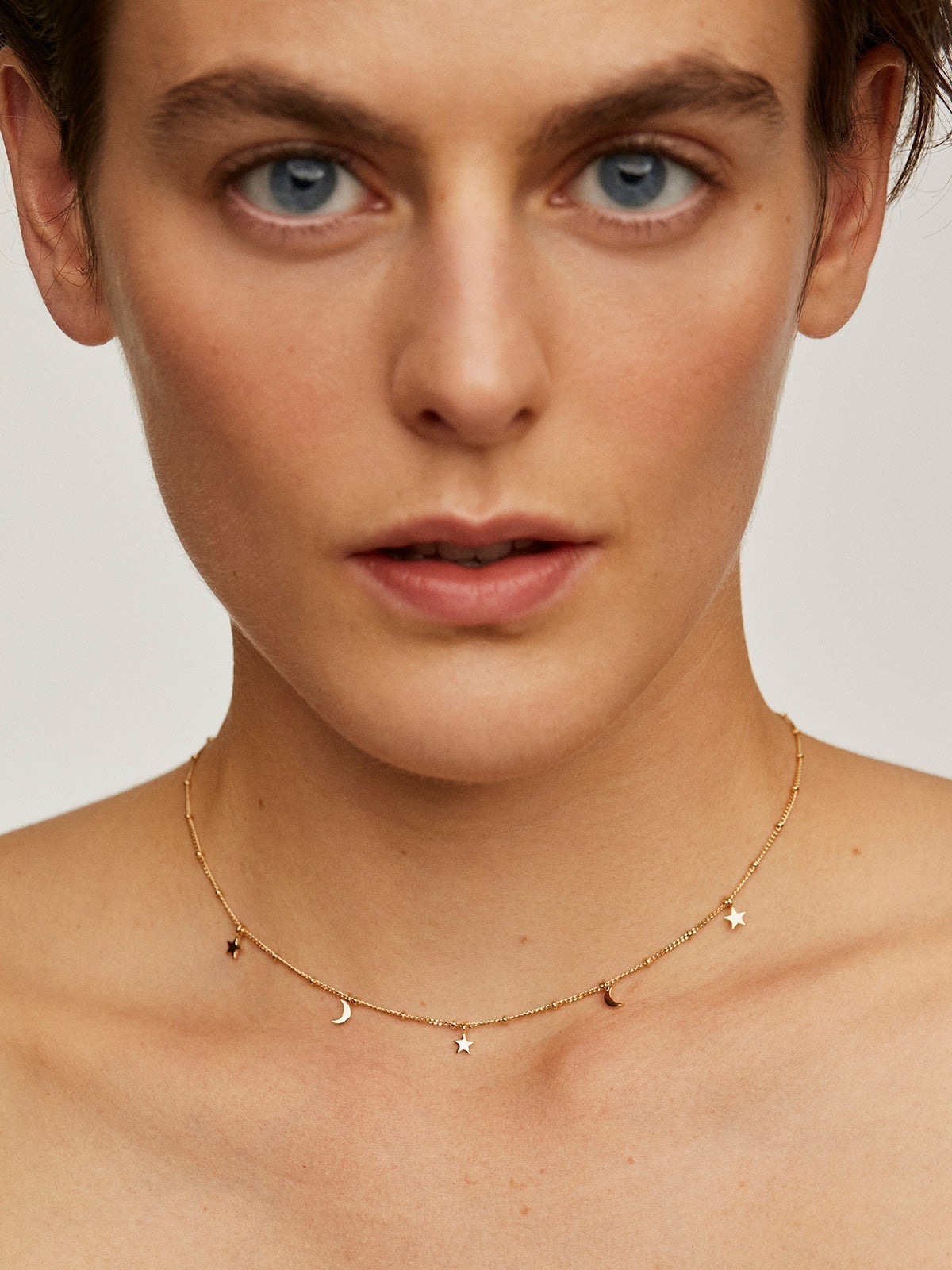 925 Silver necklace coated in 18K yellow gold with stars and moons.