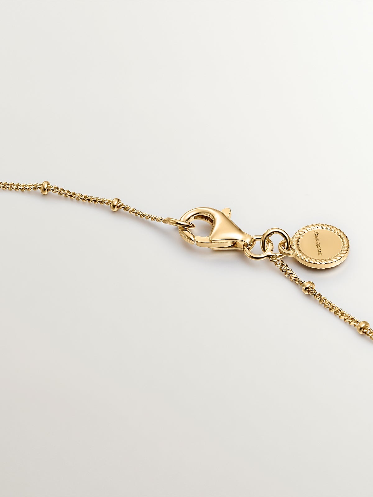925 Silver necklace coated in 18K yellow gold with stars and moons.