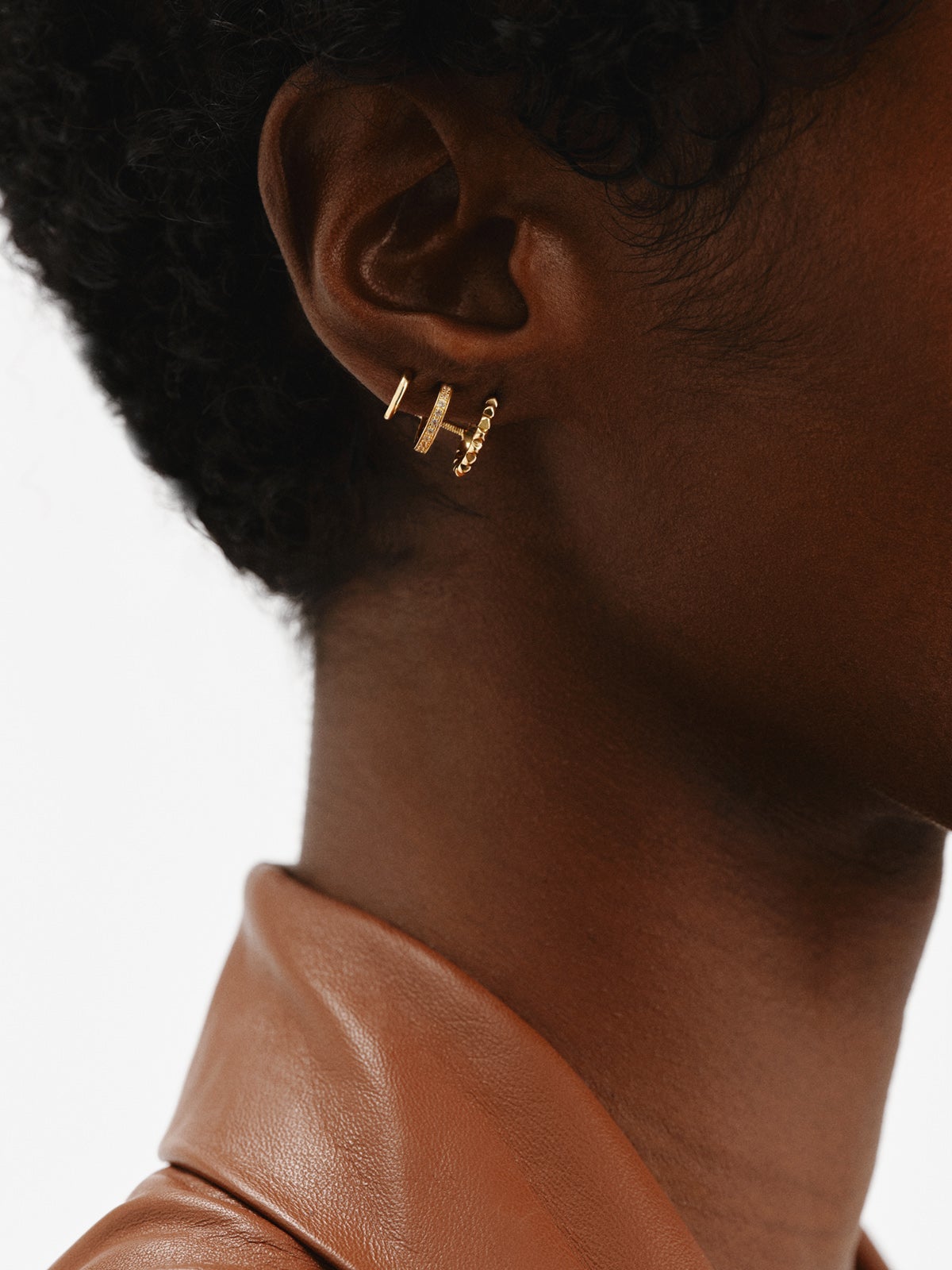 925 Silver Climber Earrings bathed in 18K Yellow Gold with White Topaz.
