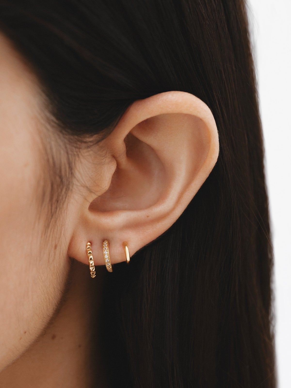 925 Silver Climber Earrings bathed in 18K Yellow Gold with White Topaz.