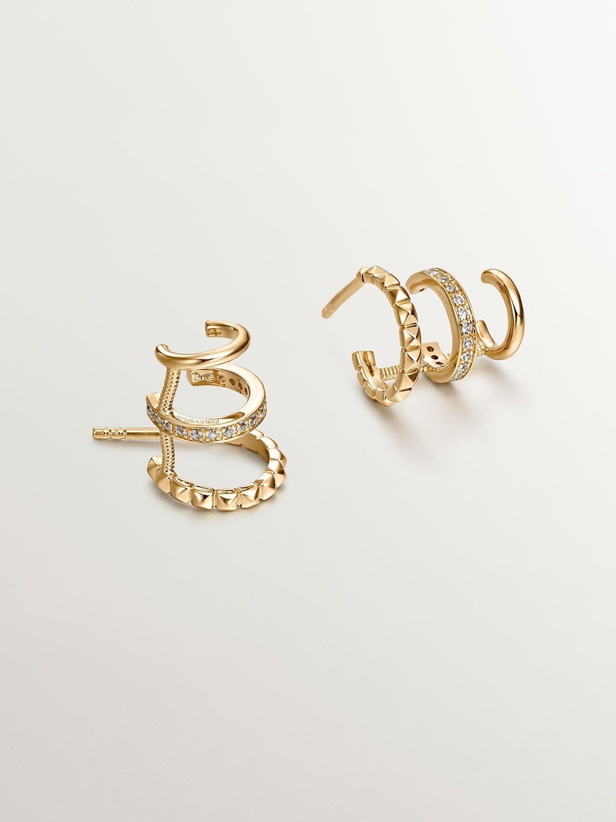 925 Silver Climber Earrings bathed in 18K Yellow Gold with White Topaz.