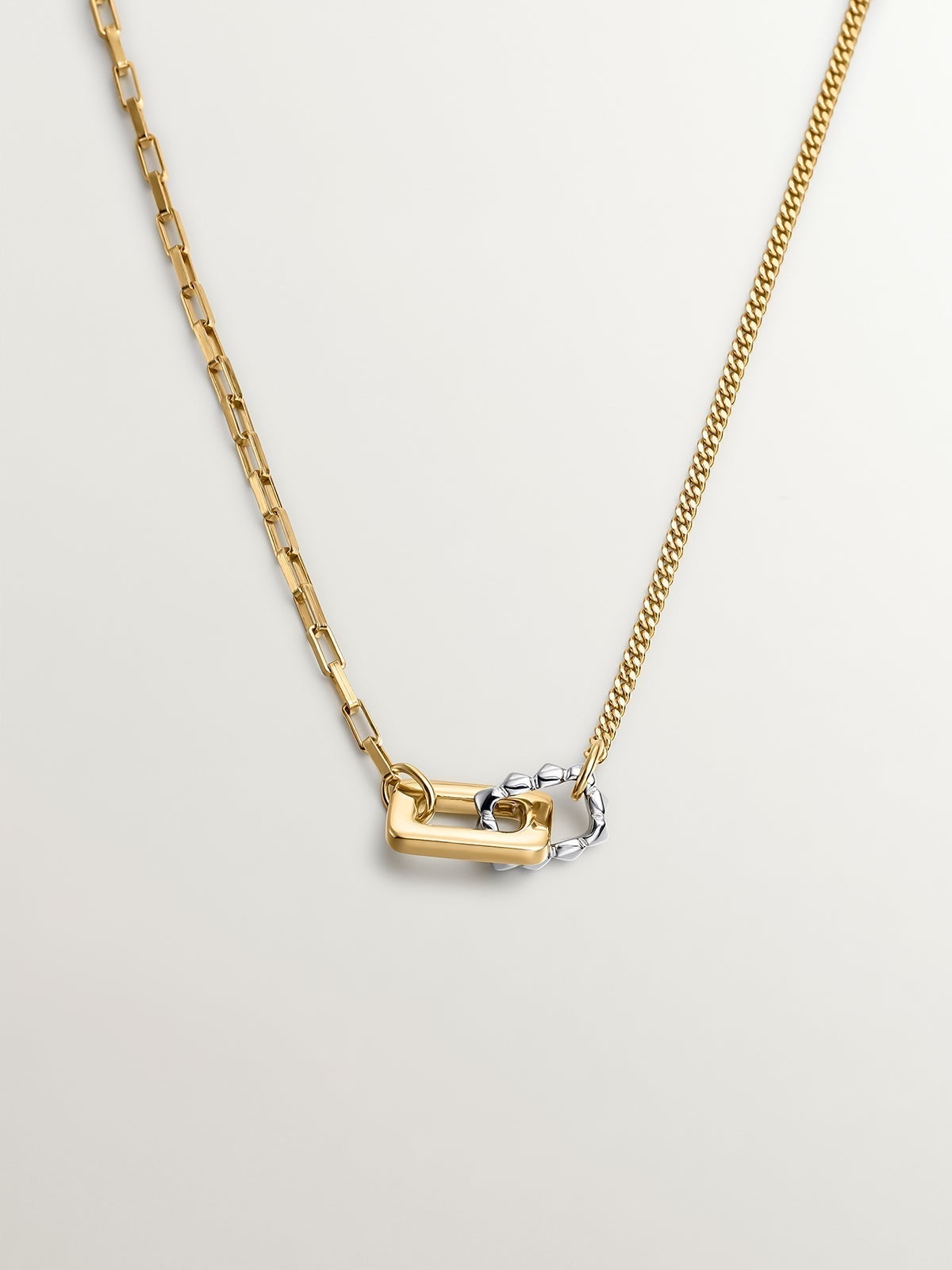Bicolor pendant of 925 silver and 925 silver bathed in 18K yellow gold with geometric shapes.