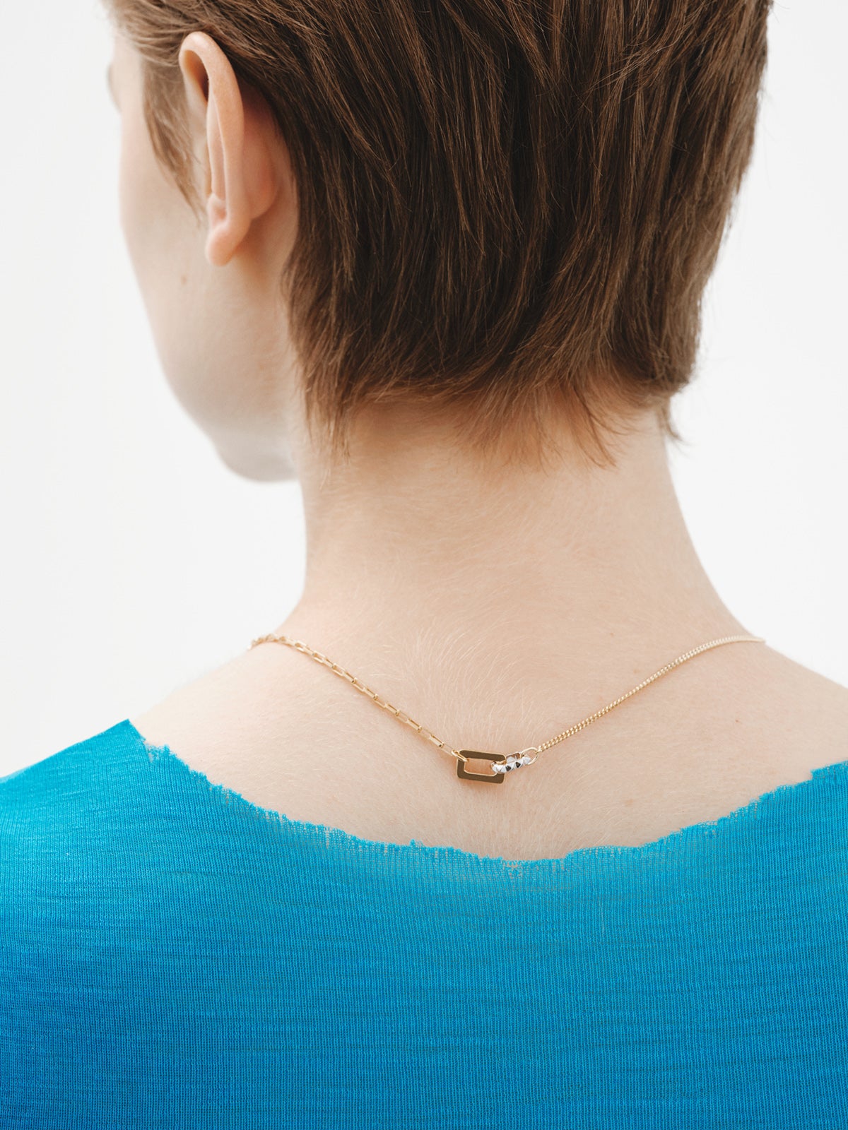 Two-tone pendant in 925 silver and 925 silver plated in 18K yellow gold with geometric shapes