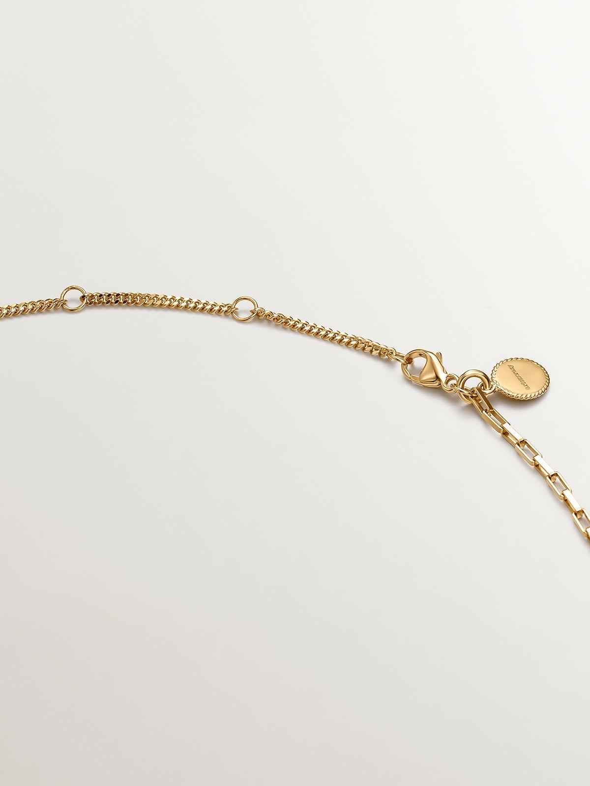 Bicolor pendant of 925 silver and 925 silver bathed in 18K yellow gold with geometric shapes.