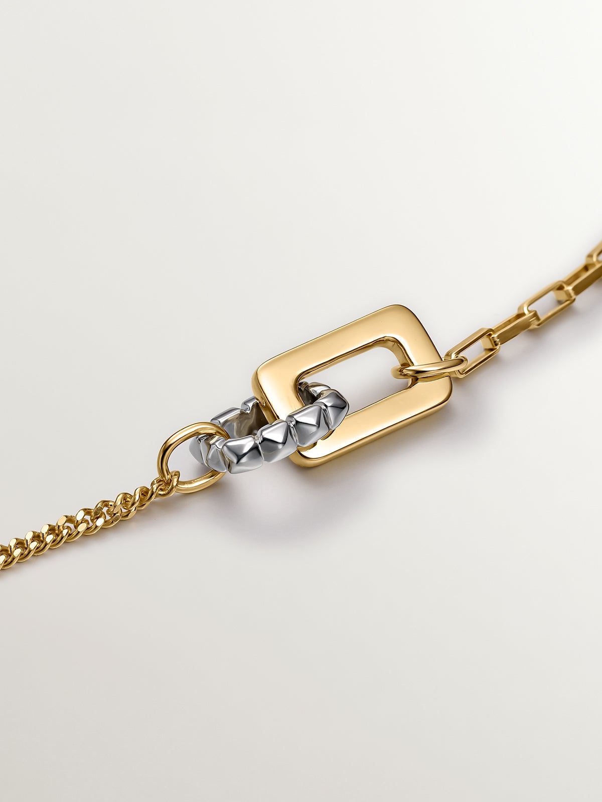 Two-tone pendant in 925 silver and 925 silver plated in 18K yellow gold with geometric shapes