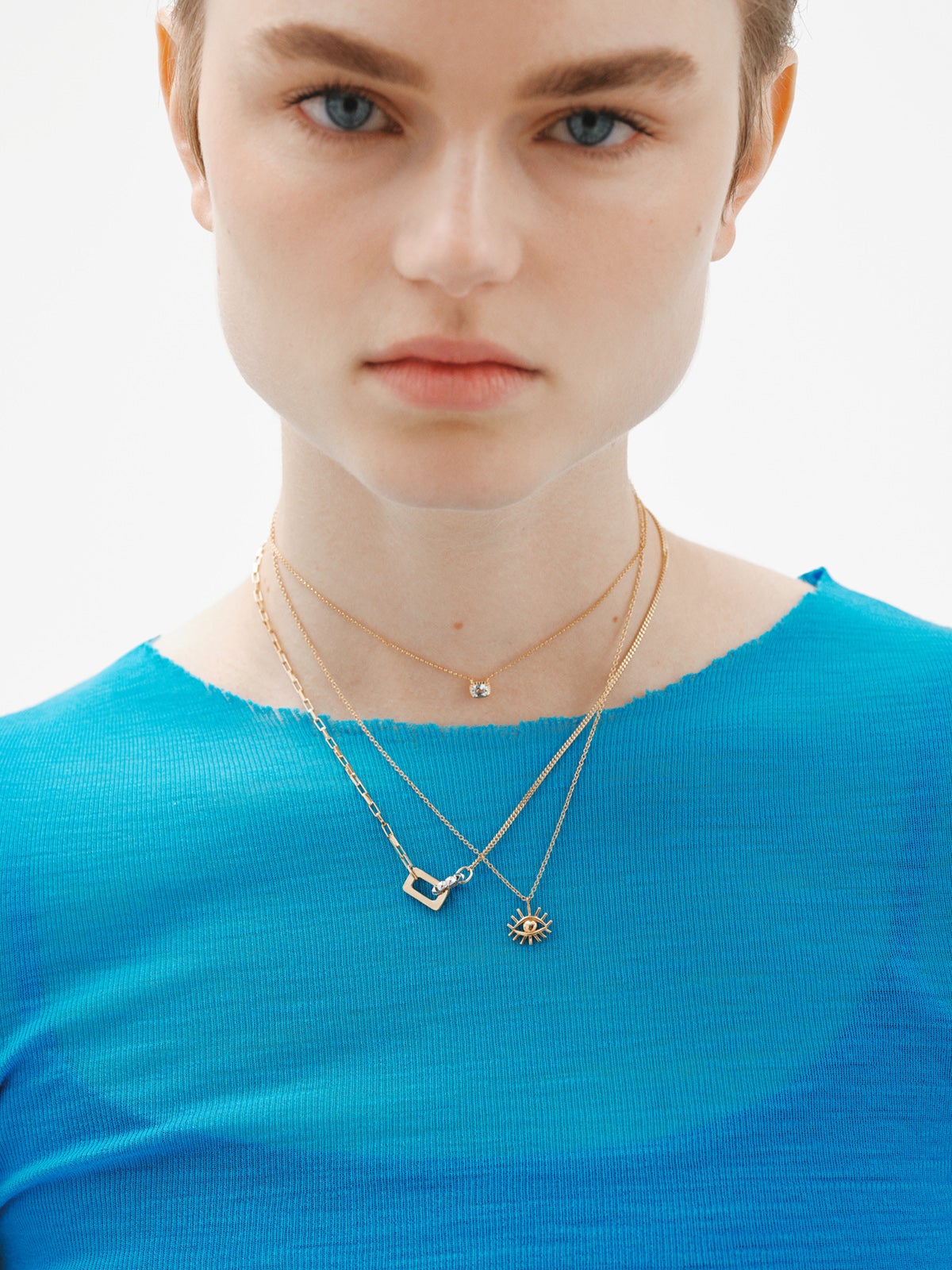Two-tone pendant in 925 silver and 925 silver plated in 18K yellow gold with geometric shapes