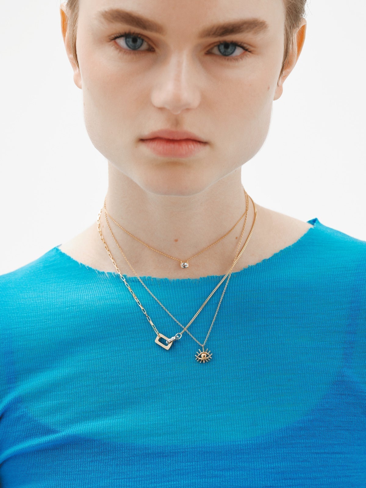 Bicolor pendant of 925 silver and 925 silver bathed in 18K yellow gold with geometric shapes.