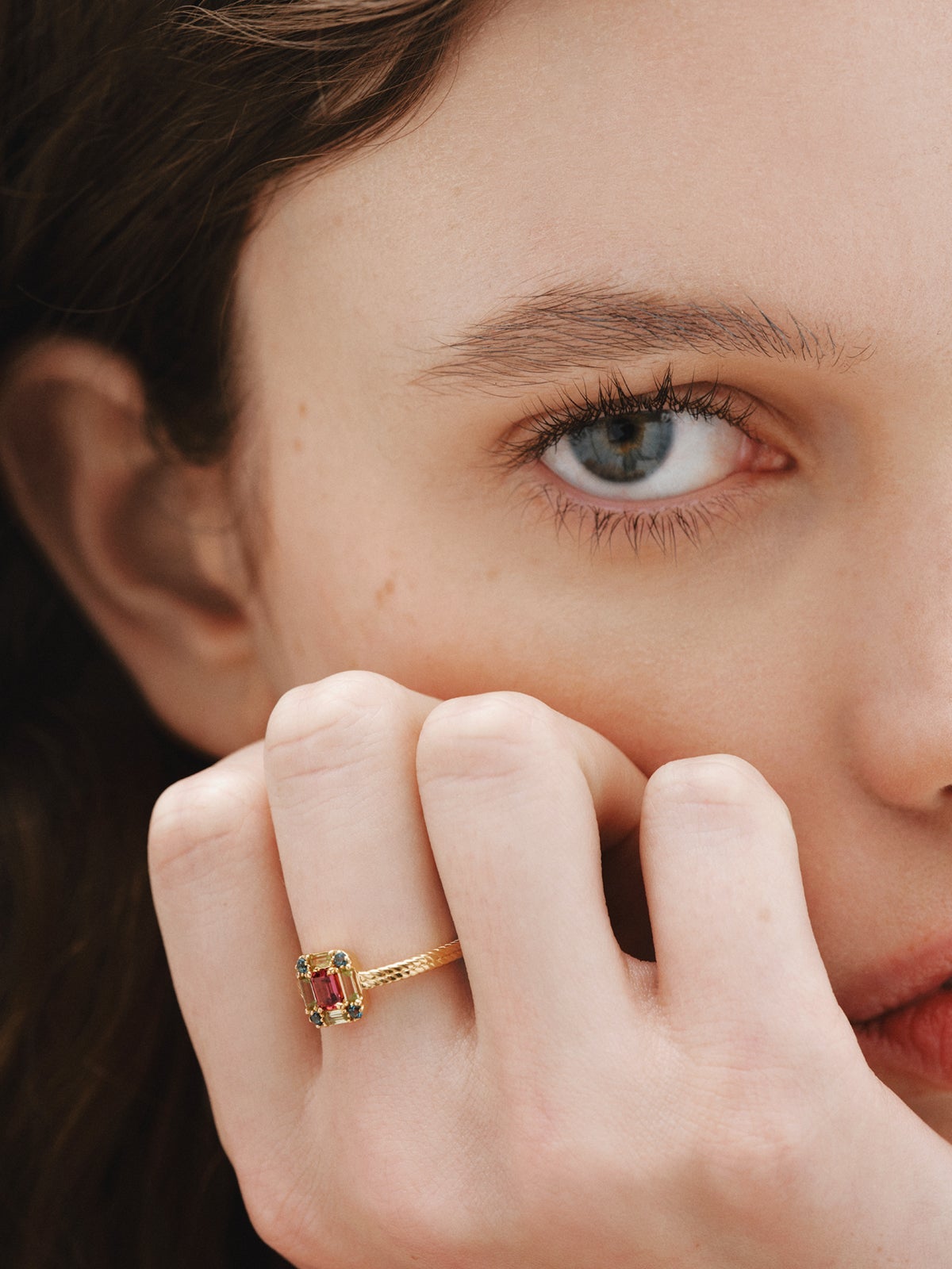 925 Silver ring bathed in 18K yellow gold with rhodolite, peridot, and topaz.