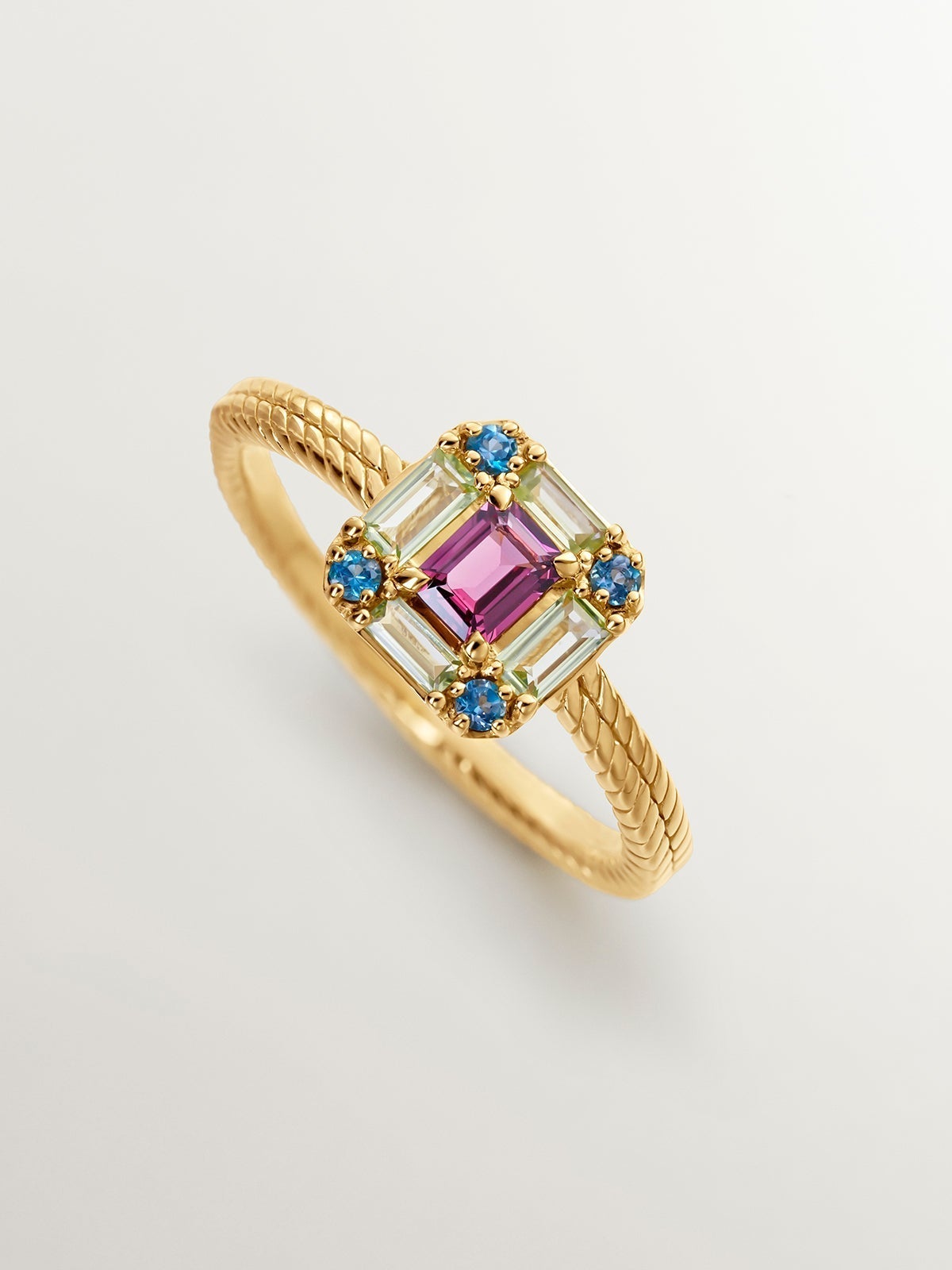 925 Silver ring bathed in 18K yellow gold with rhodolite, peridot, and topaz.