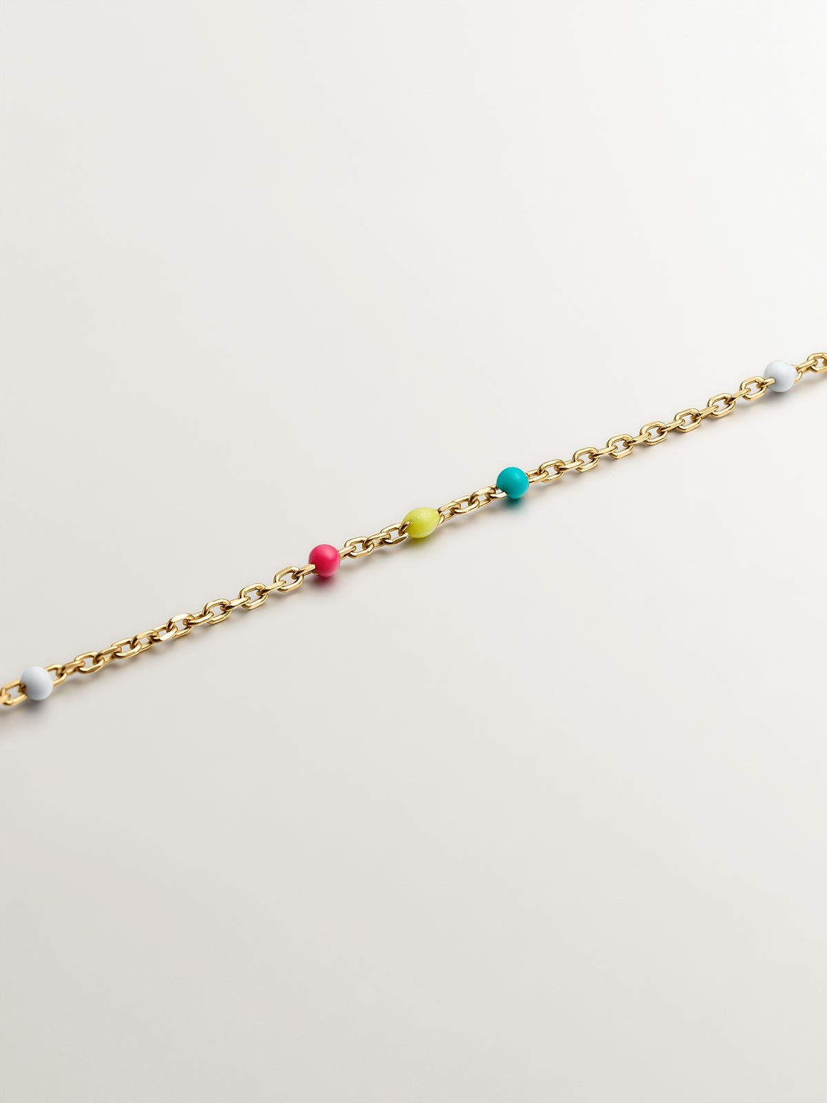 925 Silver chain dipped in 18K yellow gold with multicolor enamel.