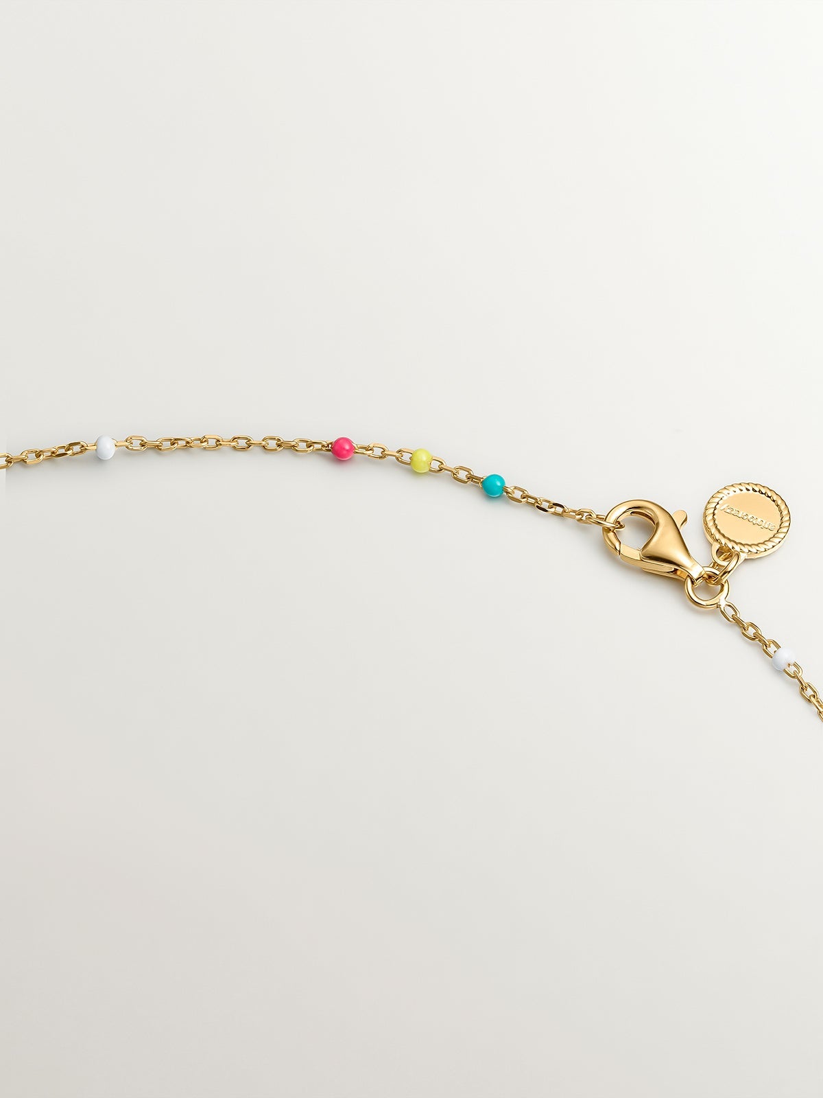 925 Silver chain dipped in 18K yellow gold with multicolor enamel.