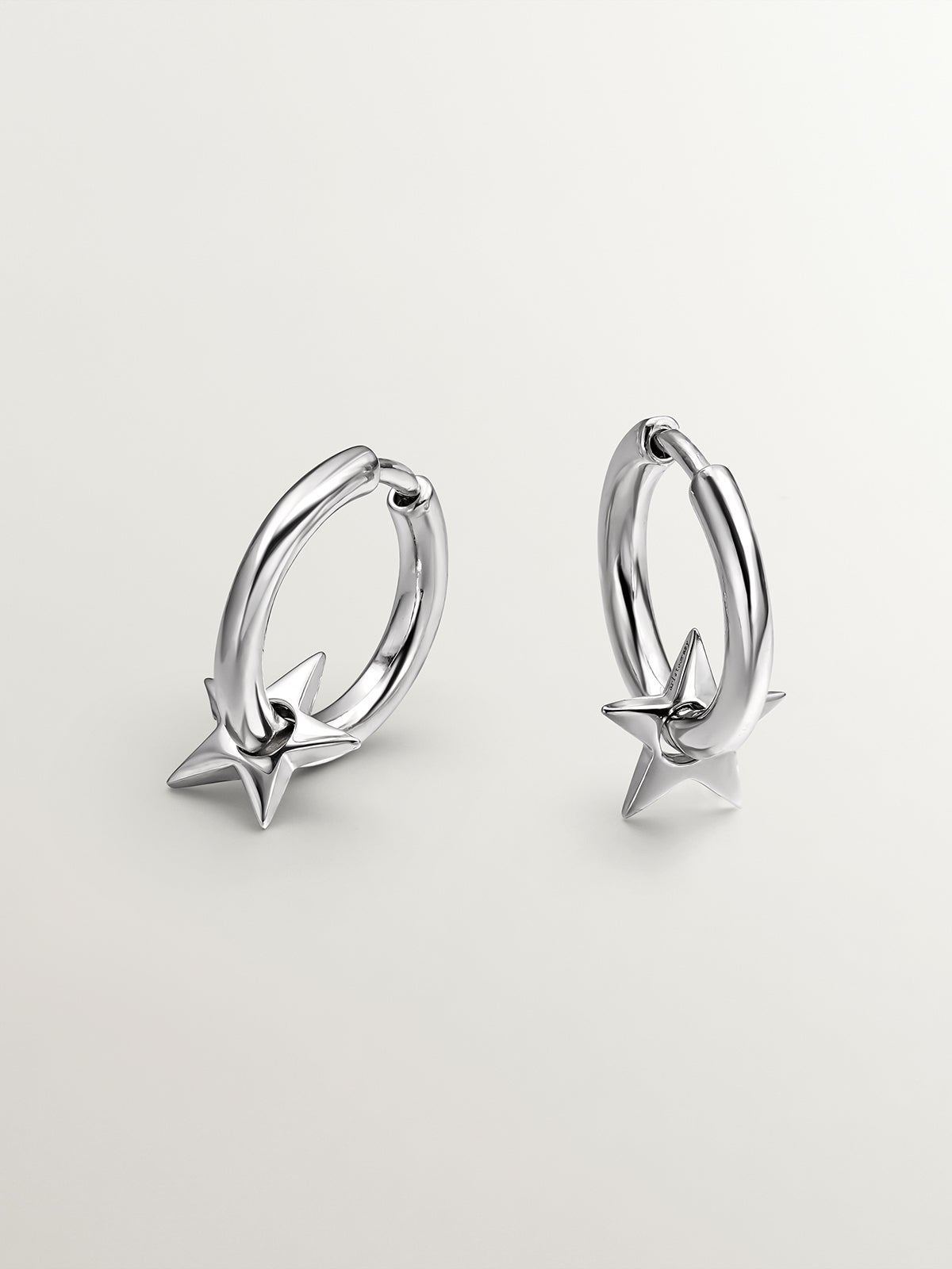 Small 925 silver hoop earrings with star.