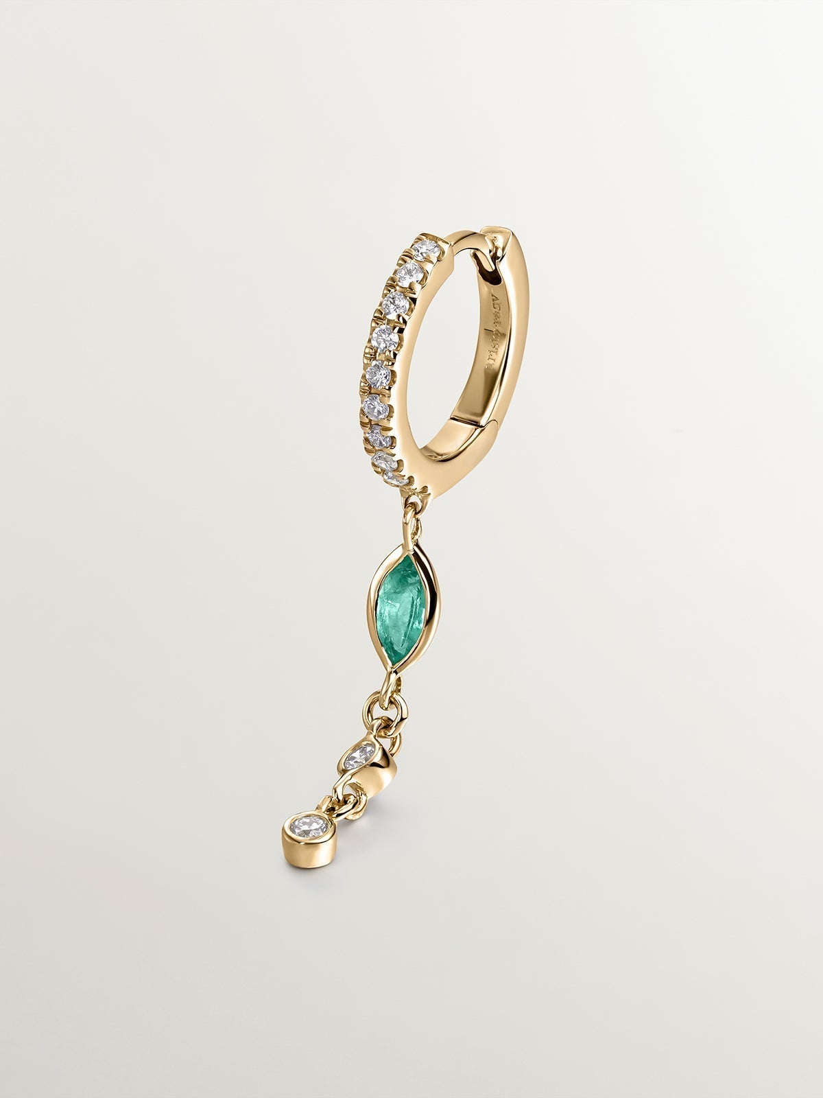 Individual small hoop earring made of 9K yellow gold with a diamond chain and emerald.