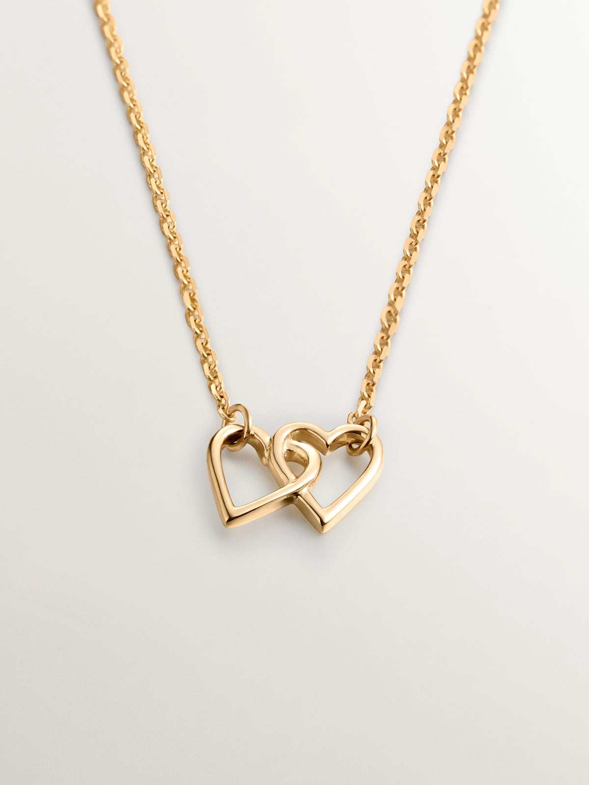 9K yellow gold pendant with interlocking hearts