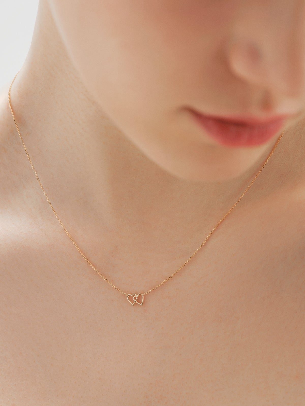 9K yellow gold pendant with interlocking hearts