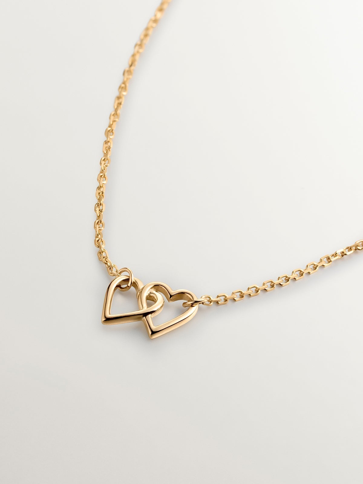 9K yellow gold pendant with interlocking hearts