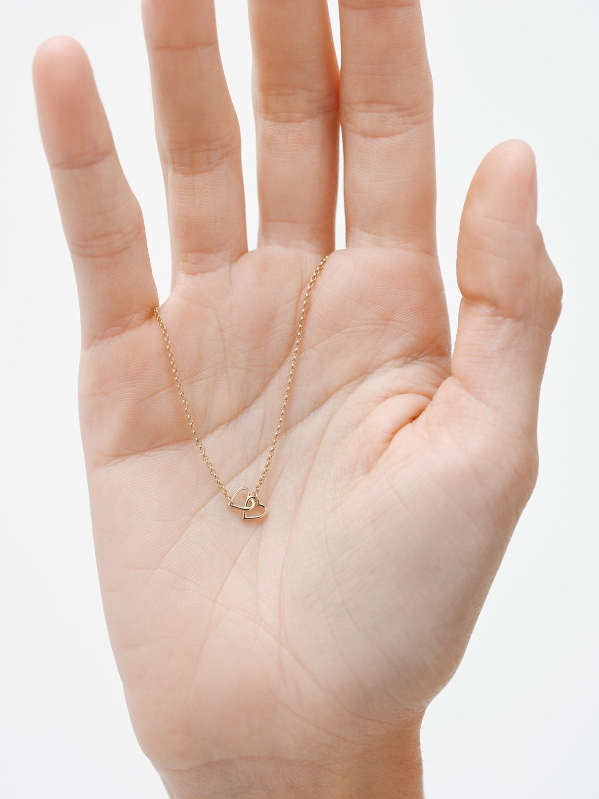 9K Yellow Gold bracelet with interlaced hearts