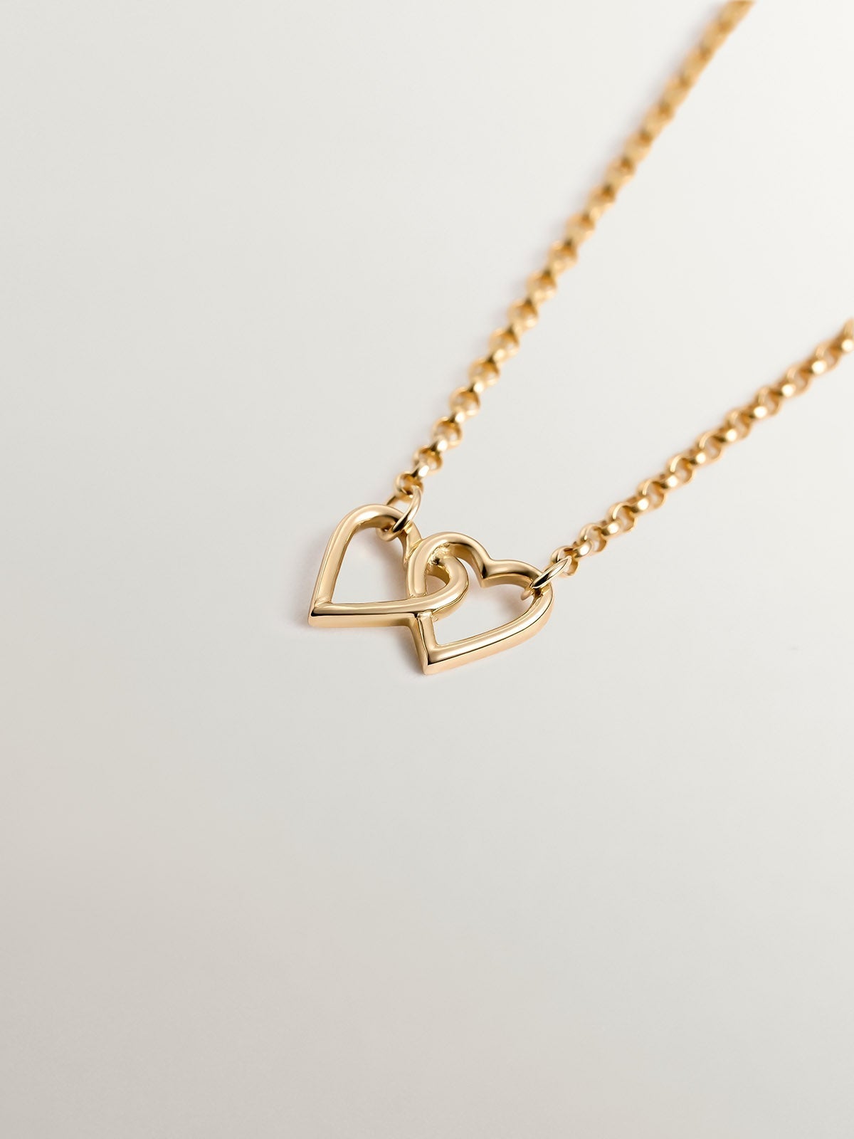 9K Yellow Gold bracelet with interlaced hearts