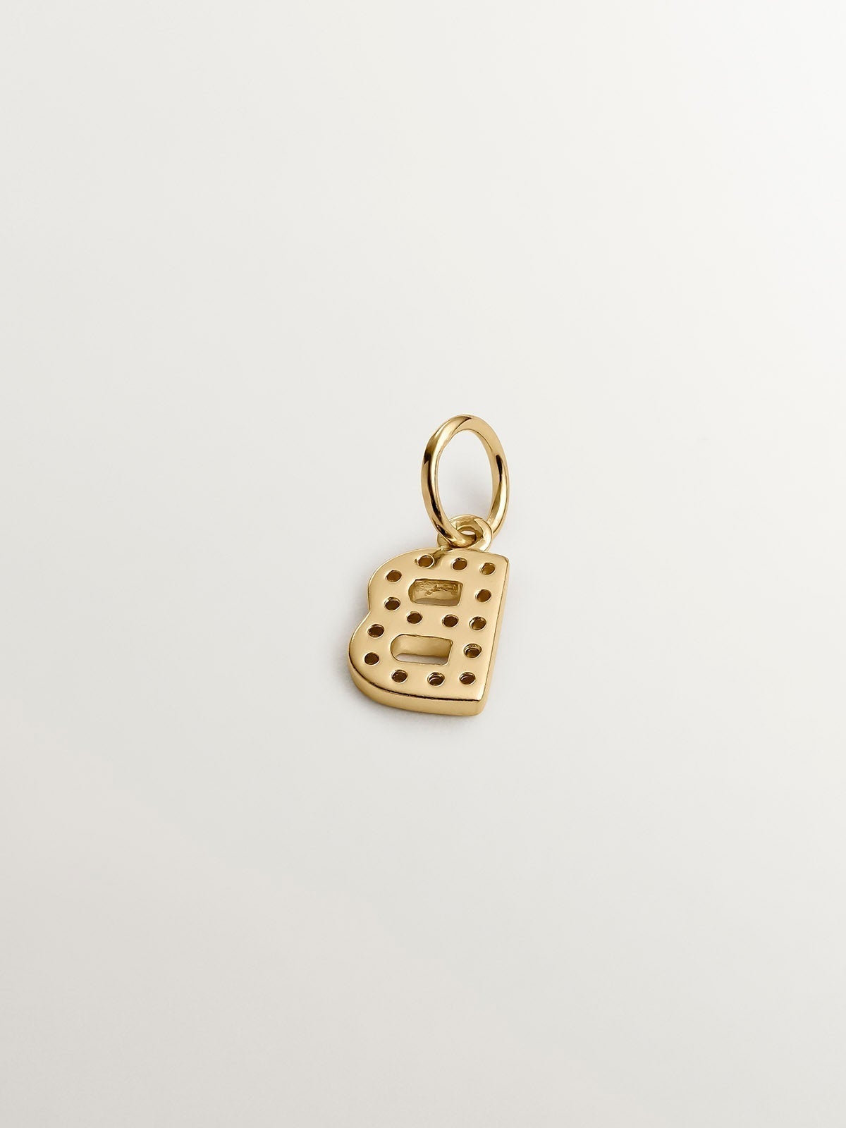 Initial B charm, made of 925 silver coated in 18K yellow gold and adorned with white topaz.