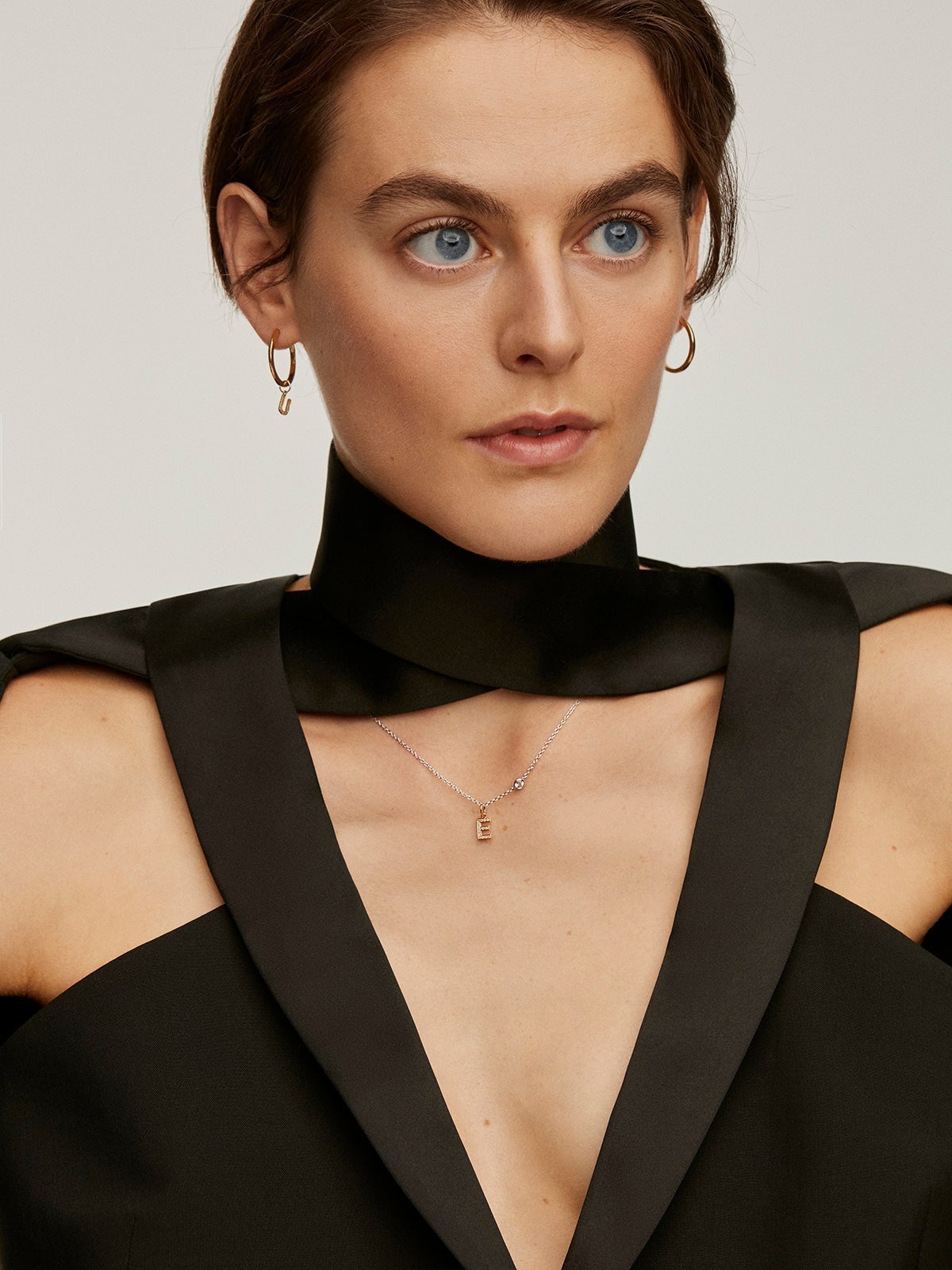18K yellow gold-plated 925 silver charm with white topaz, initial E.