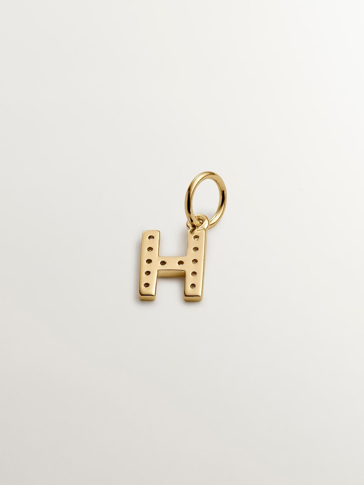 925 Silver charm bathed in 18K yellow gold and white topazes initial H.