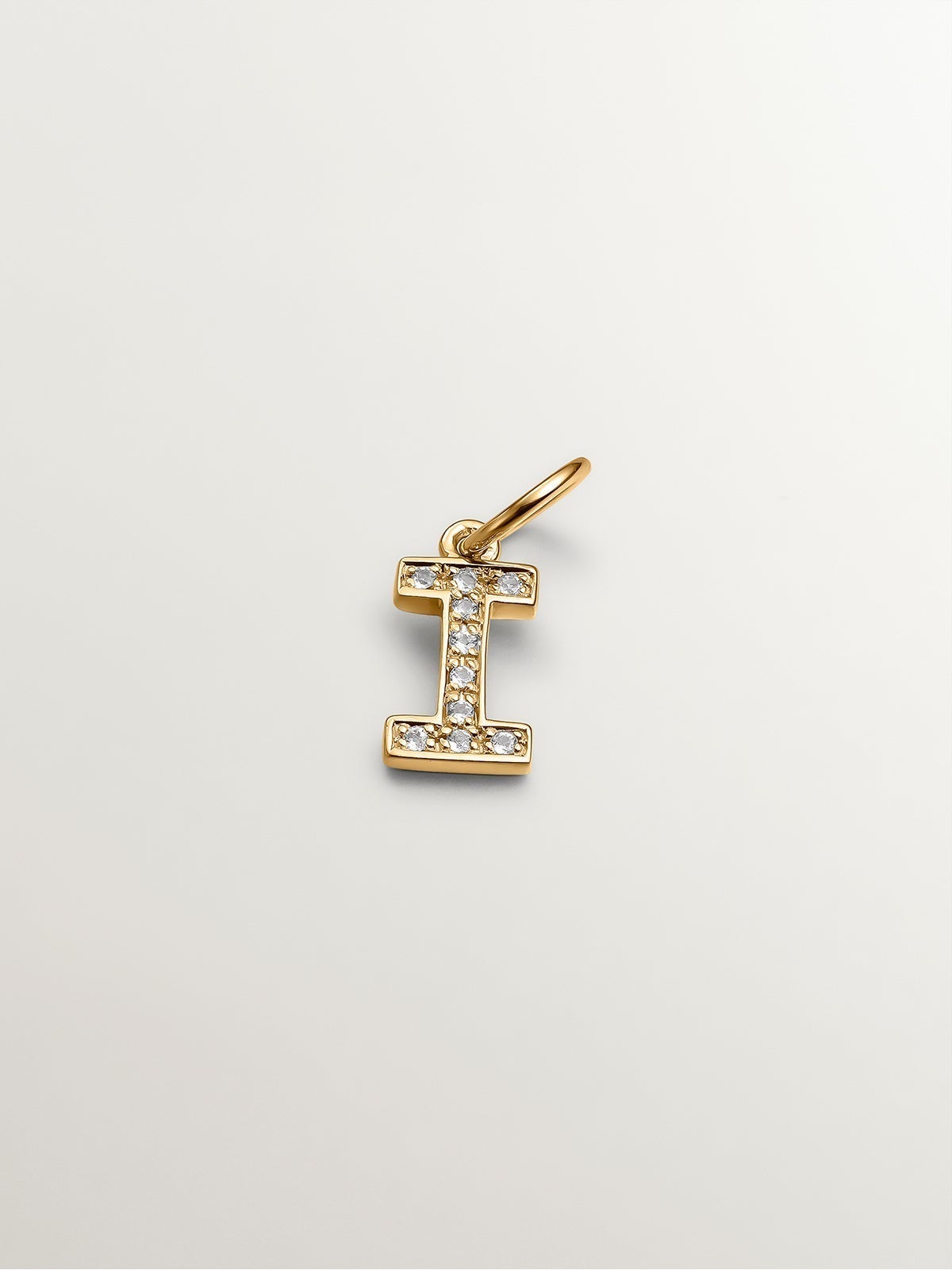 I Initial charm made of 925 silver, bathed in 18K yellow gold, and white topaz.