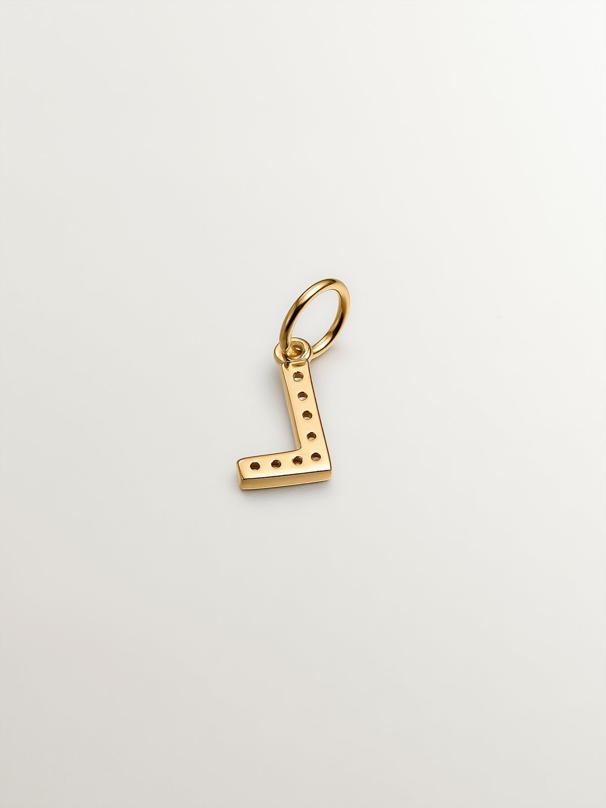 925 Sterling silver charm bathed in 18K yellow gold and white topaz with the initial L.