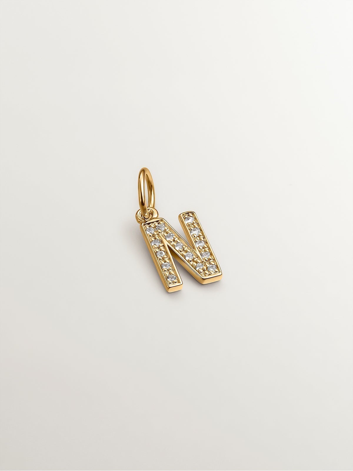 925 Silver charm bathed in 18K yellow gold and white topaz initial N
