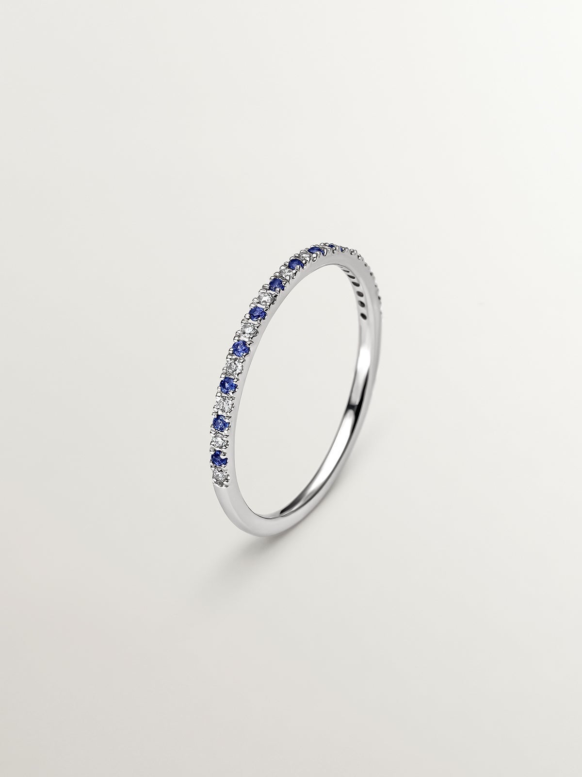 9K white gold ring with sapphires and diamonds