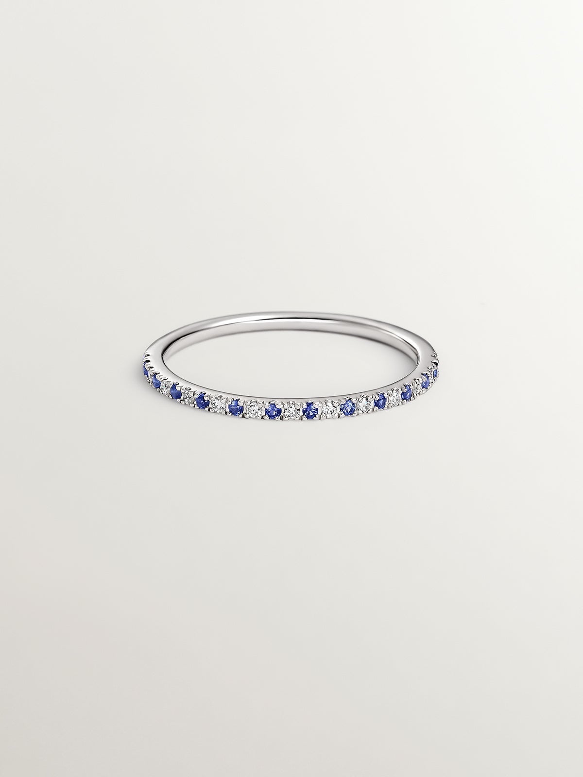 9K white gold ring with sapphires and diamonds