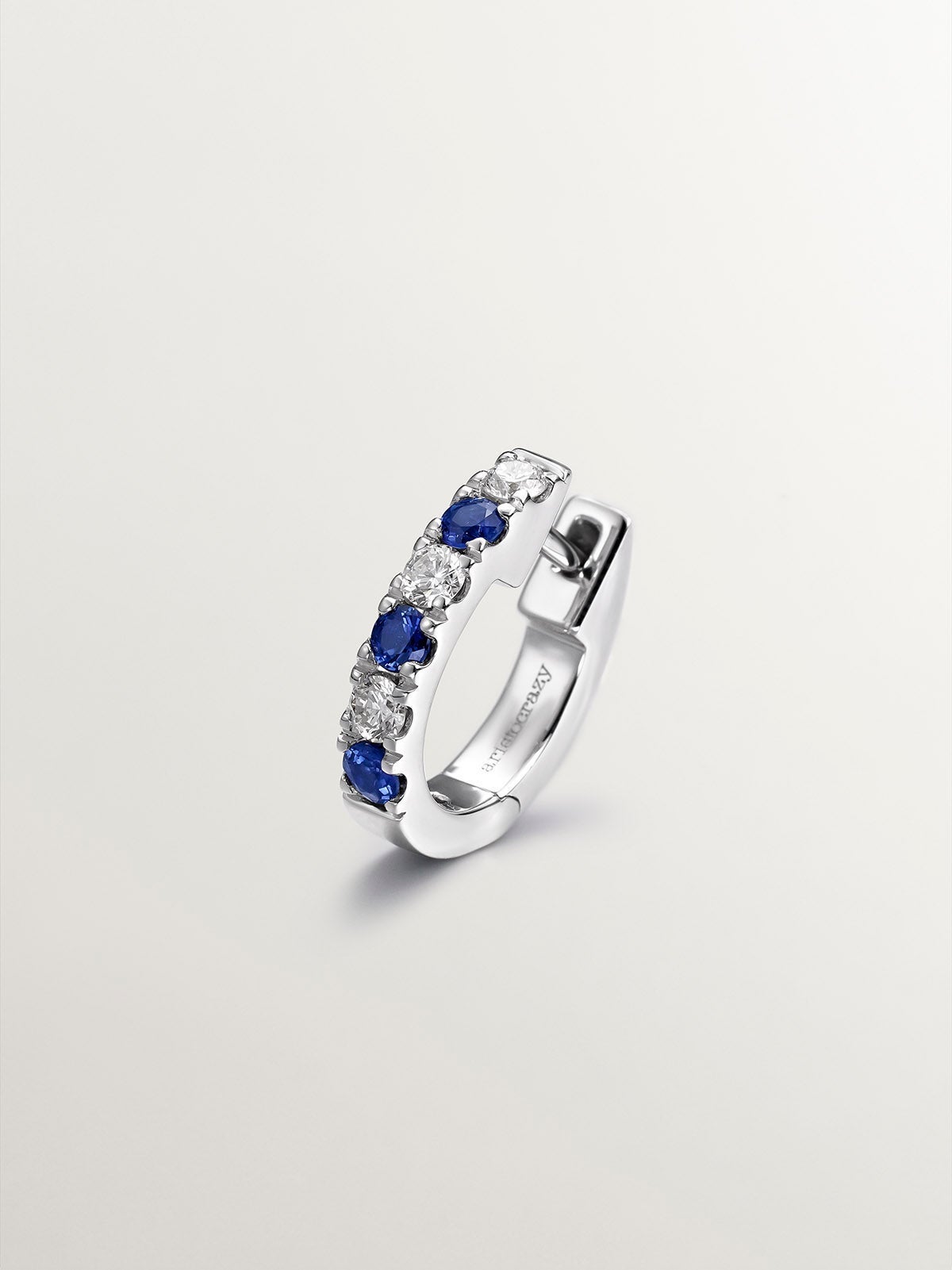 Individual small 9K white gold hoop earring with blue sapphires and diamonds