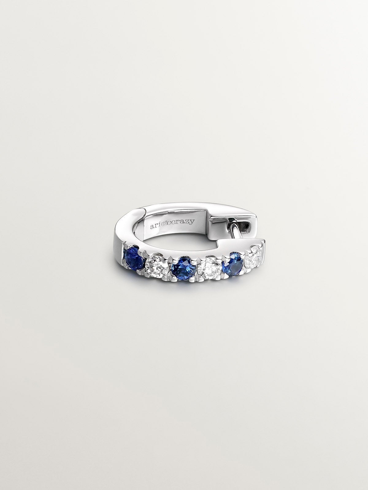 Individual small 9K white gold hoop earring with blue sapphires and diamonds