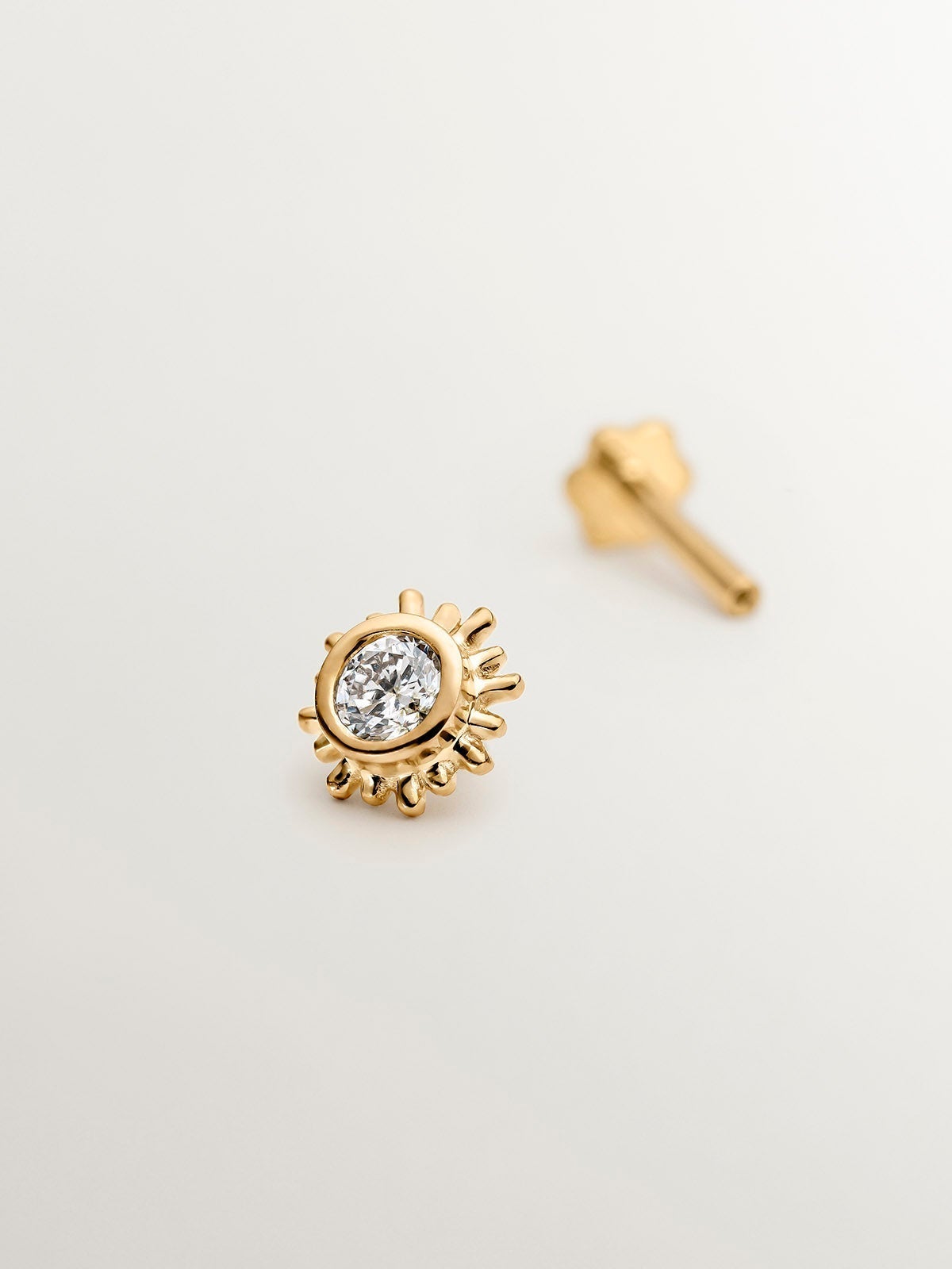 18K yellow gold piercing with diamond