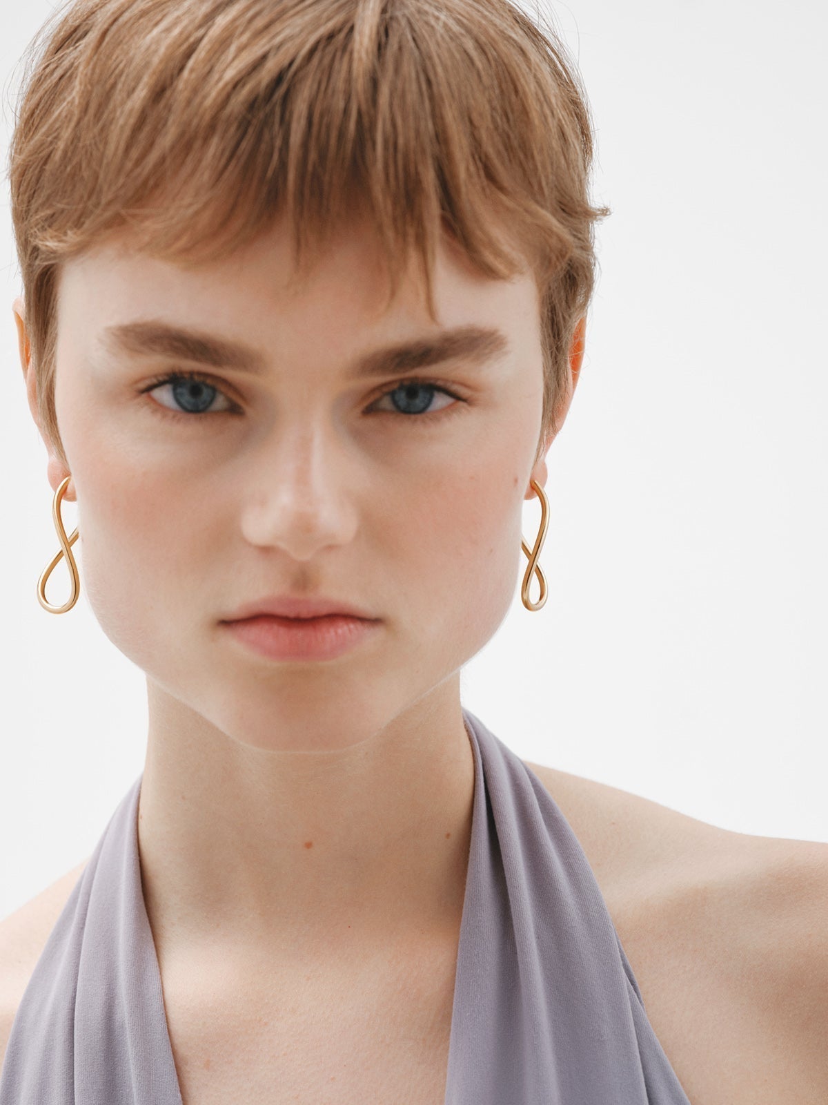 Large wavy hoop earrings made of 925 silver plated in 18K yellow gold